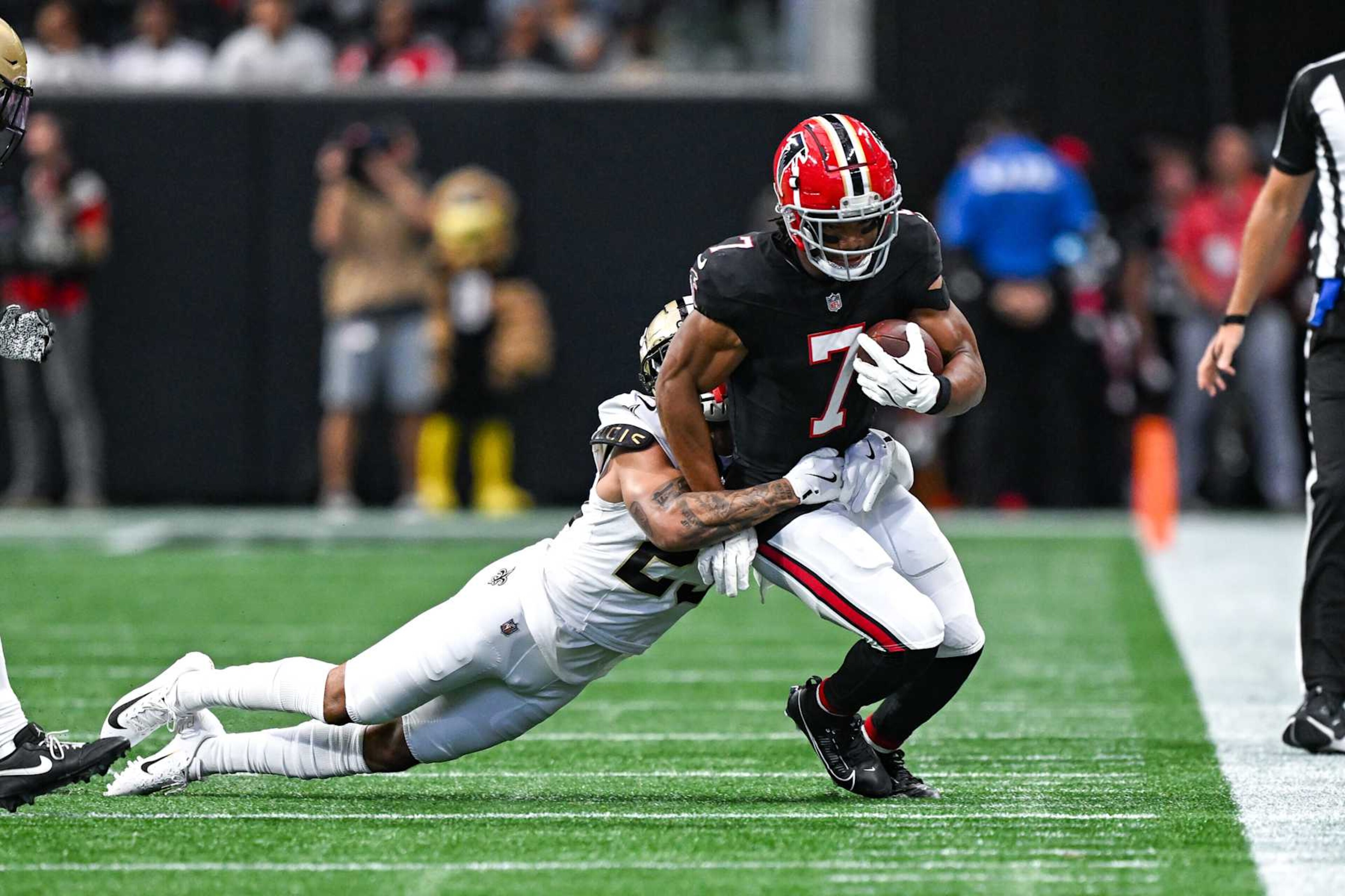 Bijan Robinson runs the ball against the Saints. Bijan Robinson runs the ball against the Saints.