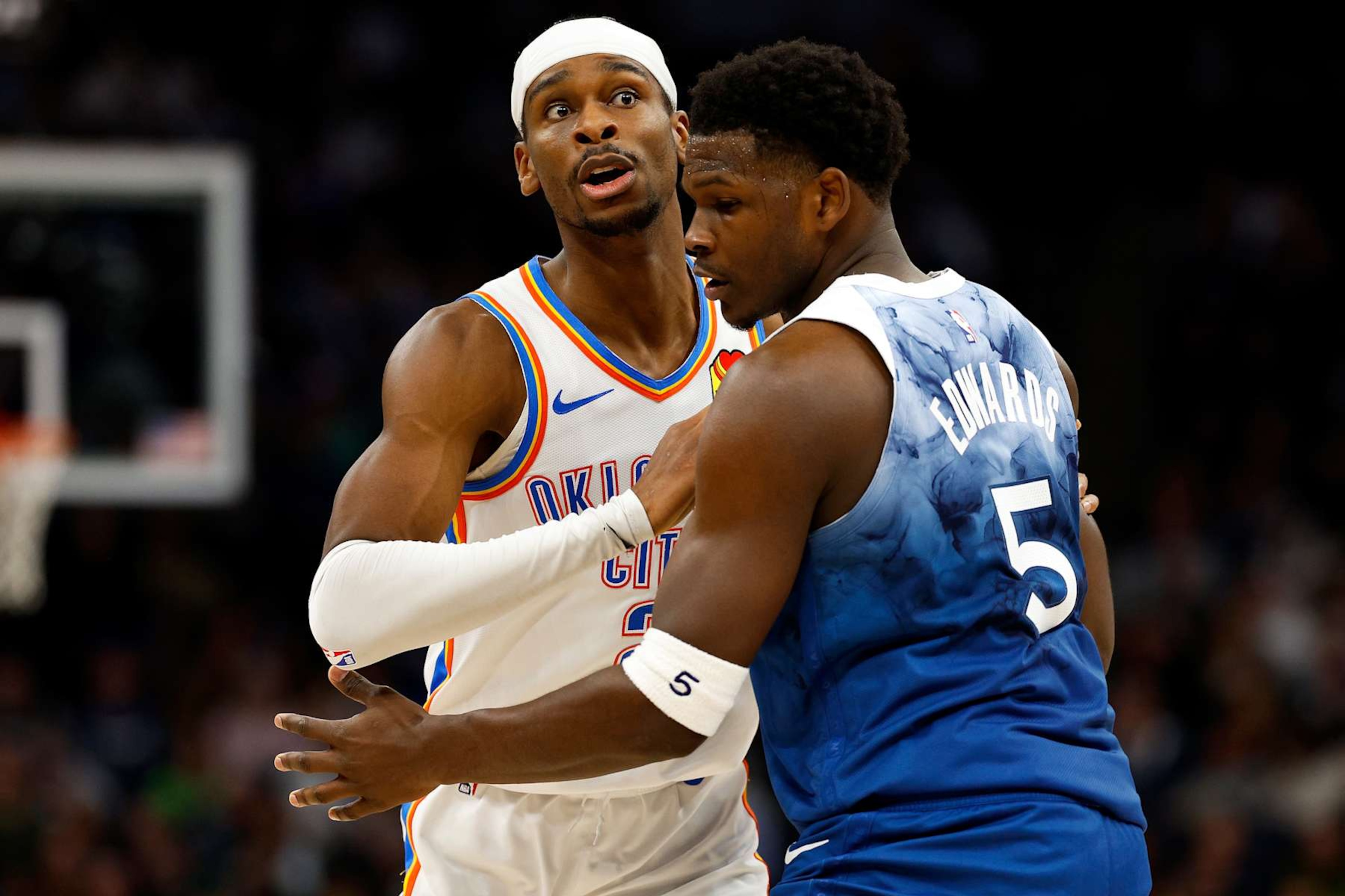 MINNEAPOLIS, MINNESOTA - JANUARY 20: Shai Gilgeous-Alexander #2 of the Oklahoma City Thunder competes against Anthony Edwards #5 of the Minnesota Timberwolves in the third quarter at Target Center on January 20, 2024 in Minneapolis, Minnesota. The Thunder defeated the Timberwolves 102-97. NOTE TO USER: User expressly acknowledges and agrees that, by downloading and or using this photograph, User is consenting to the terms and conditions of the Getty Images License Agreement. (Photo by David Berding/Getty Images)