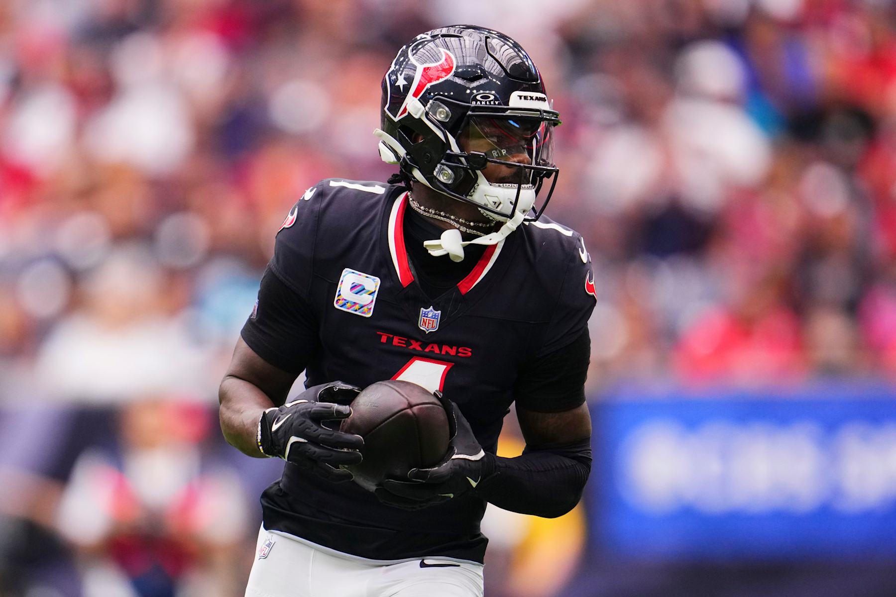 HOUSTON, TX - SEPTEMBER 29: Stefon Diggs #1 of the Houston Texans runs with the ball against the Jacksonville Jaguars during the first half of a football game at NRG Stadium on September 29, 2024 in Houston, Texas. (Photo by Cooper Neill/Getty Images)