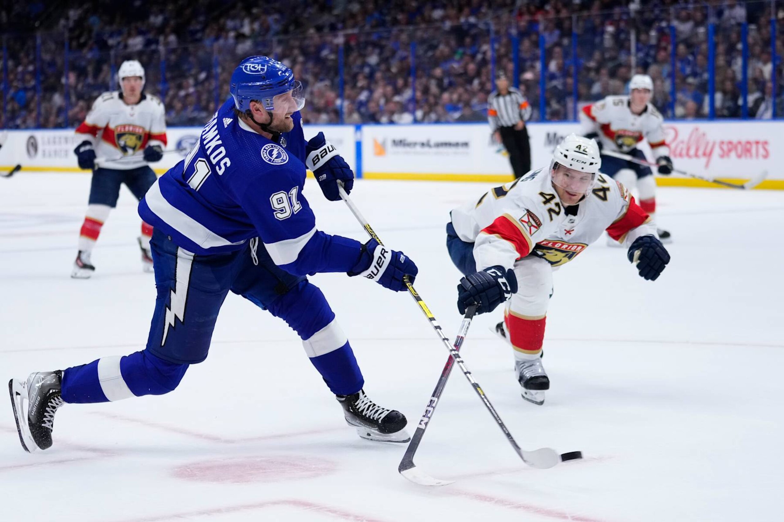 TAMPA, FLORIDA - APRIL 27: Steven Stamkos #91 of the Tampa Bay Lightning takes a shot against Gustav Forsling #42 of the Florida Panthers during the second period of Game Four of the First Round of the 2024 Stanley Cup Playoffs at Amalie Arena on April 27, 2024 in Tampa, Florida. (Photo by Rich Storry/Getty Images)