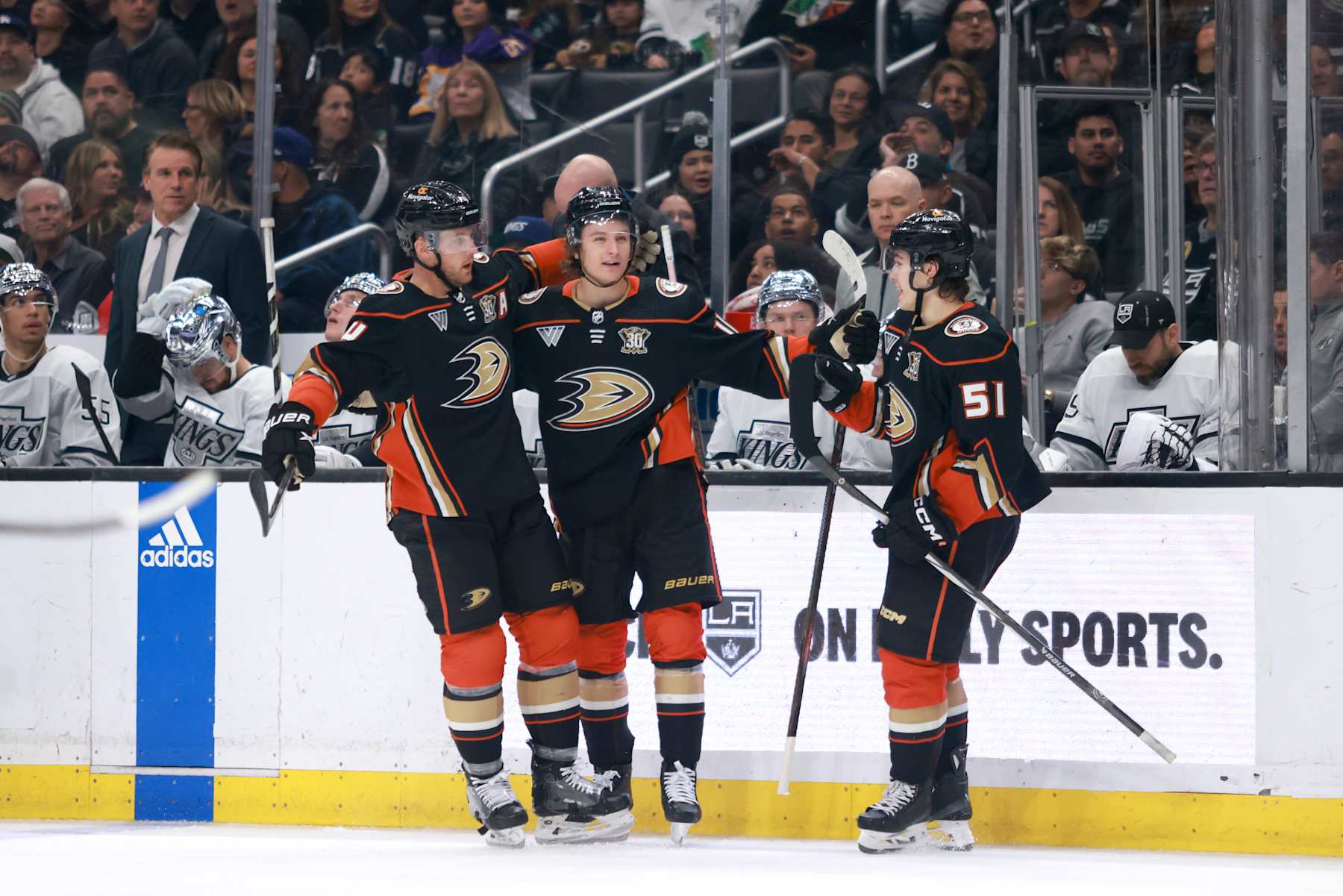 LOS ANGELES, CALIFORNIA - APRIL 13: Trevor Zegras #11, Olen Zellweger #51 and Cam Fowler #4 of the Anaheim Ducks celebrate a goal in the third period during the game against the Los Angeles Kings at Crypto.com Arena on April 13, 2024 in Los Angeles, California. (Photo by Nicole Vasquez/NHLI via Getty Images)
