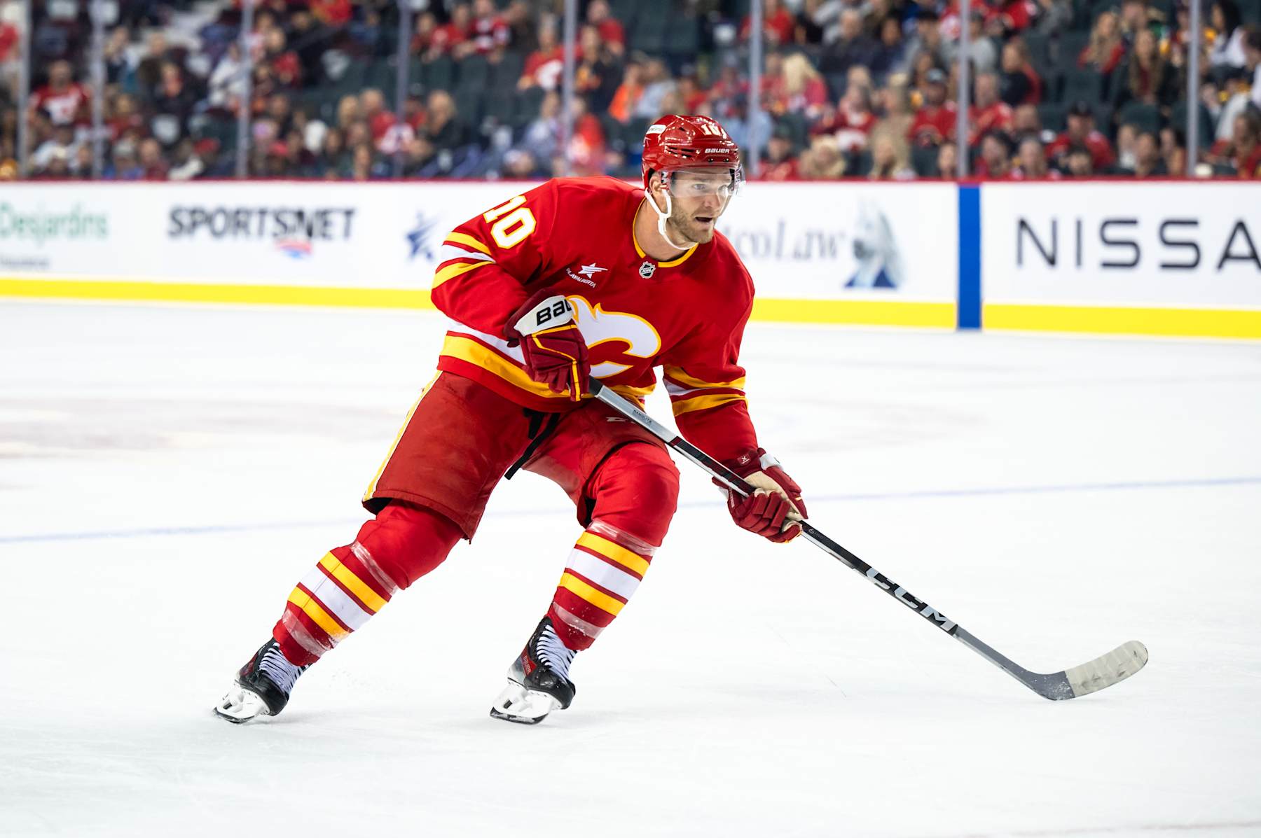 CALGARY, AB - SEPTEMBER 28: Calgary Flames Left Wing Jonathan Huberdeau (10) skates during the third period of an NHL preseason game between the Calgary Flames and the Vancouver Canucks on September 28, 2024, at the Scotiabank Saddledome in Calgary, AB. (Photo by Brett Holmes/Icon Sportswire via Getty Images)