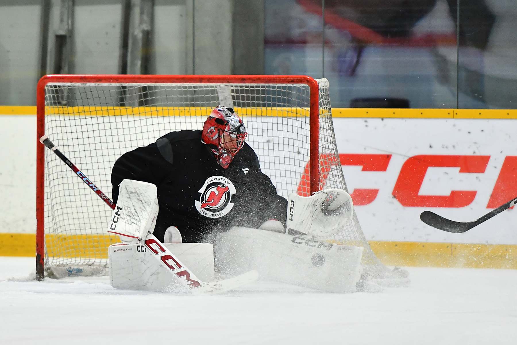 PRAGUE, CZECH REPUBLIC - SEPTEMBER 30: Goaltender Jacob Markstrom #25 of the New Jersey Devils blocks a shot during practice prior to the 2024 NHL Global Series Czechia on September 30, 2024 in Prague, Czech Republic.  (Photo by Ben Jackson/NHLI via Getty Images)