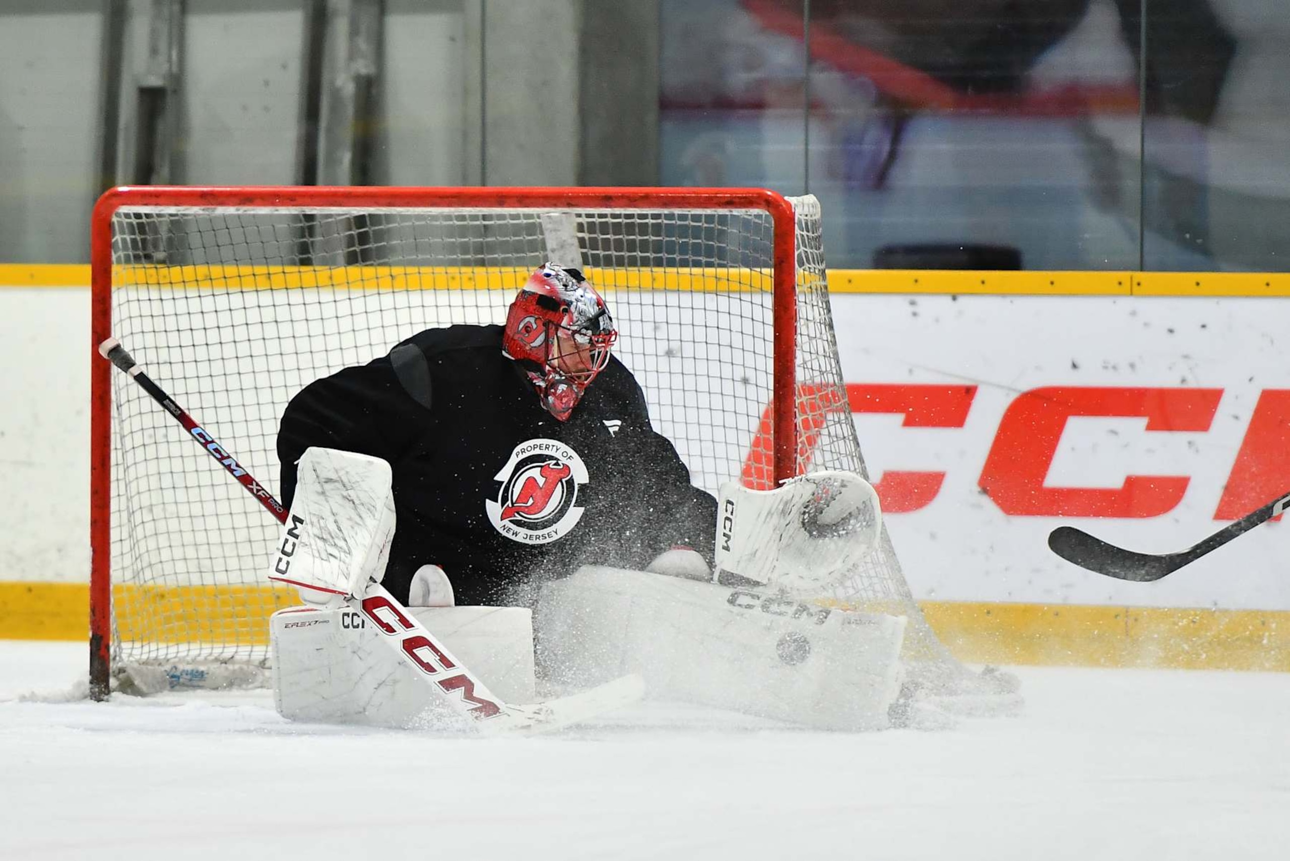 PRAGUE, CZECH REPUBLIC - SEPTEMBER 30: Goaltender Jacob Markstrom #25 of the New Jersey Devils blocks a shot during practice prior to the 2024 NHL Global Series Czechia on September 30, 2024 in Prague, Czech Republic.  (Photo by Ben Jackson/NHLI via Getty Images)
