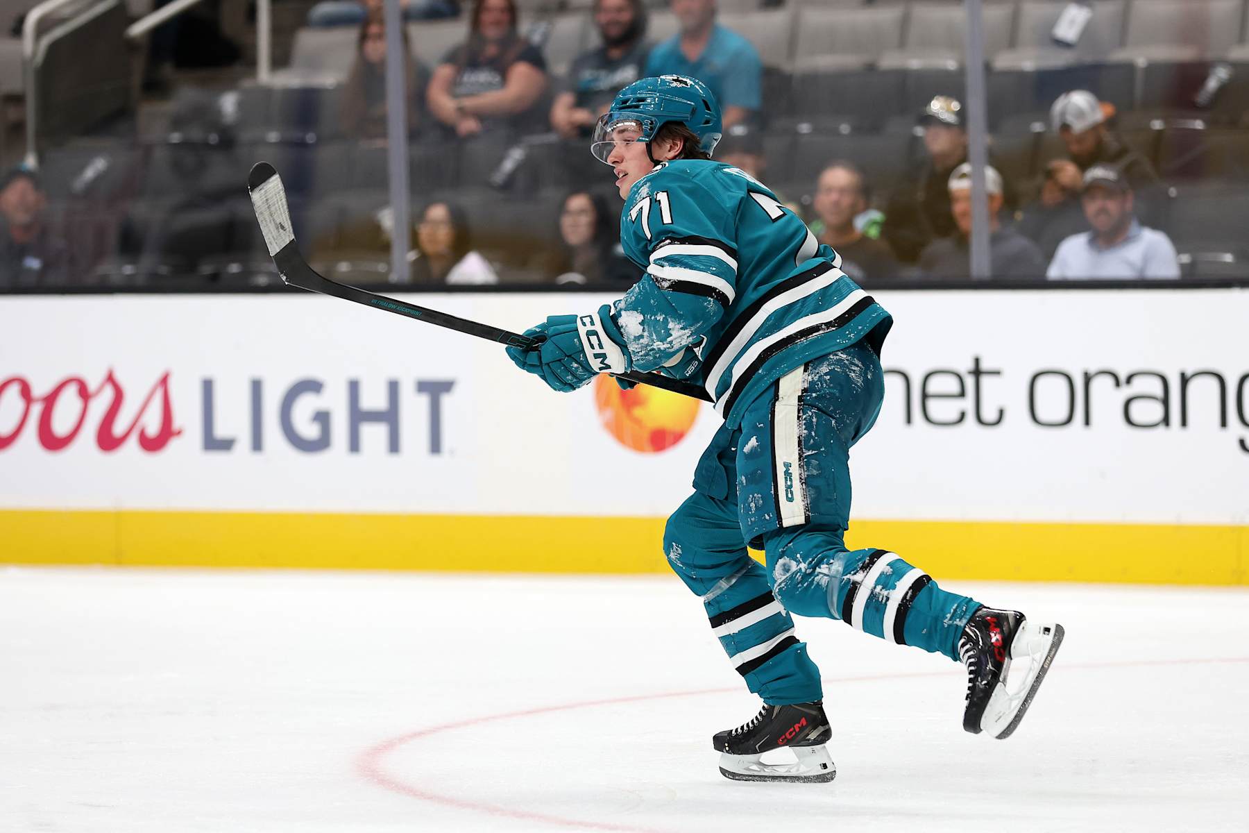 SAN JOSE, CALIFORNIA - OCTOBER 01: Macklin Celebrini #71 of the San Jose Sharks skates back to center ice after sliding into the boards in the second period of their preseason game against the Utah Hockey Club at SAP Center on October 01, 2024 in San Jose, California. He did not come back to play in the third period.  (Photo by Ezra Shaw/Getty Images)