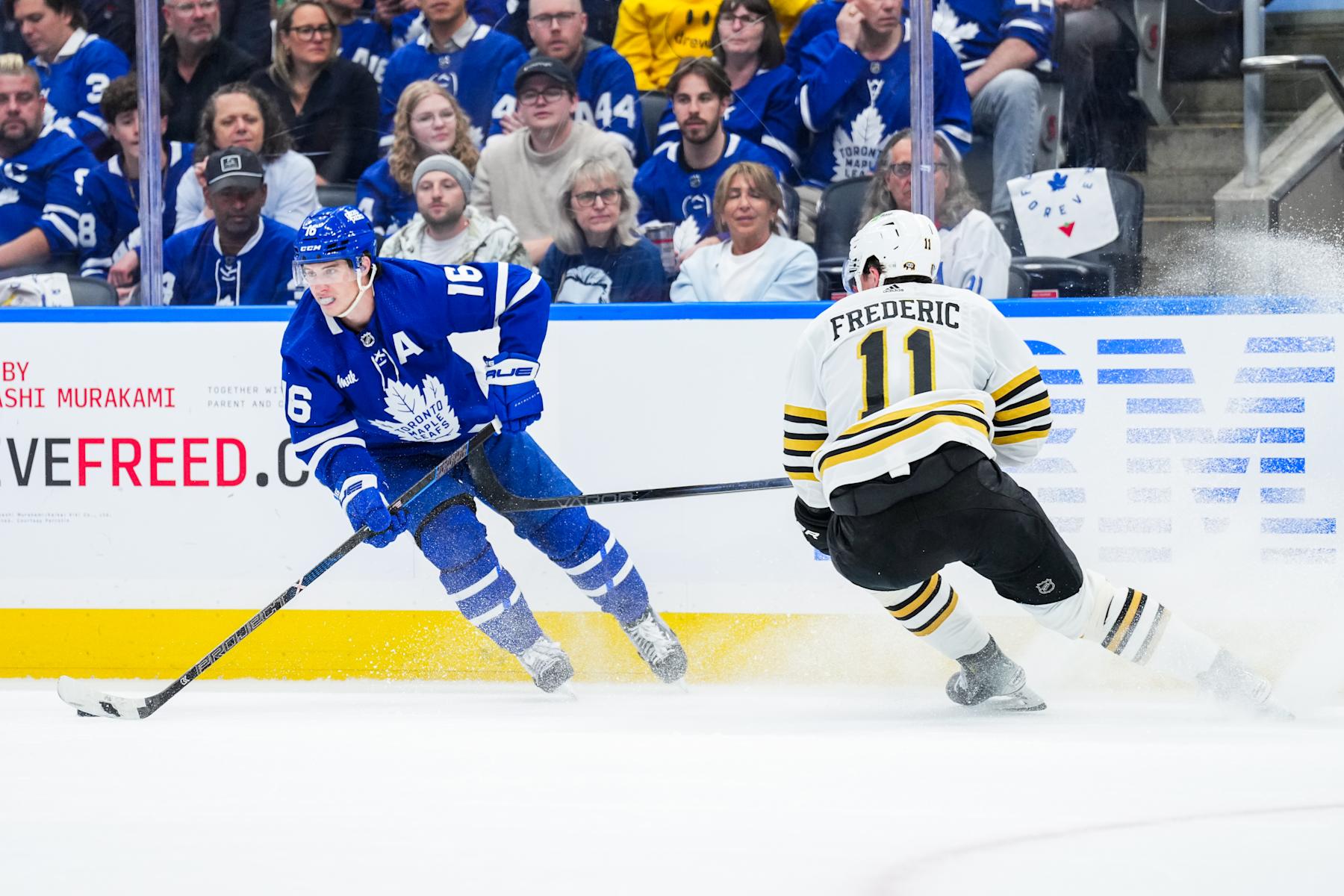 TORONTO, ON - MAY 2: Mitch Marner #16 of the Toronto Maple Leafs skates against Trent Frederic #11 of the Boston Bruins during the first period in Game Six of the First Round of the 2024 Stanley Cup Playoffs at Scotiabank Arena on May 2, 2024 in Toronto, Ontario, Canada. (Photo by Kevin Sousa/NHLI via Getty Images)