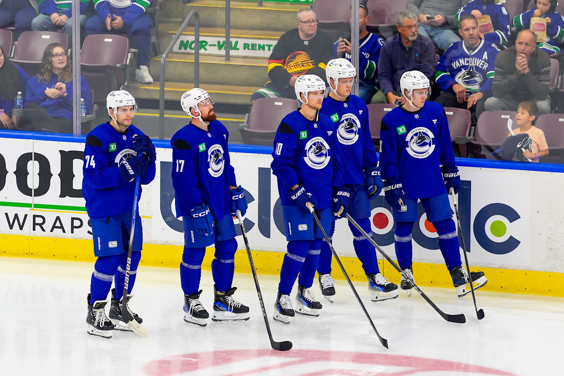 PENTICTON, CANADA - SEPTEMBER 22: Jake Debrusk #74 Filip Hronek #17 Elias Pettersson Elias Pettersson #26 and Jonathan Lekkerimaki #23 of the Vancouver Canucks look on during the Vancouver Canucks Training Camp at South Okanagan Events Centre on September 22, 2024 in Penticton, British Columbia, Canada. (Photo by Derek Cain/Getty Images)