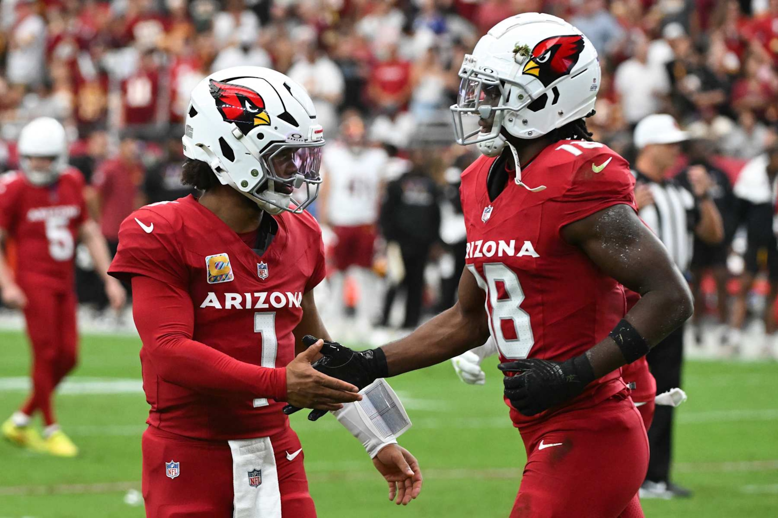 Cardinals QB Kyler Murray (left) and WR Marvin Harrison Jr. (right)