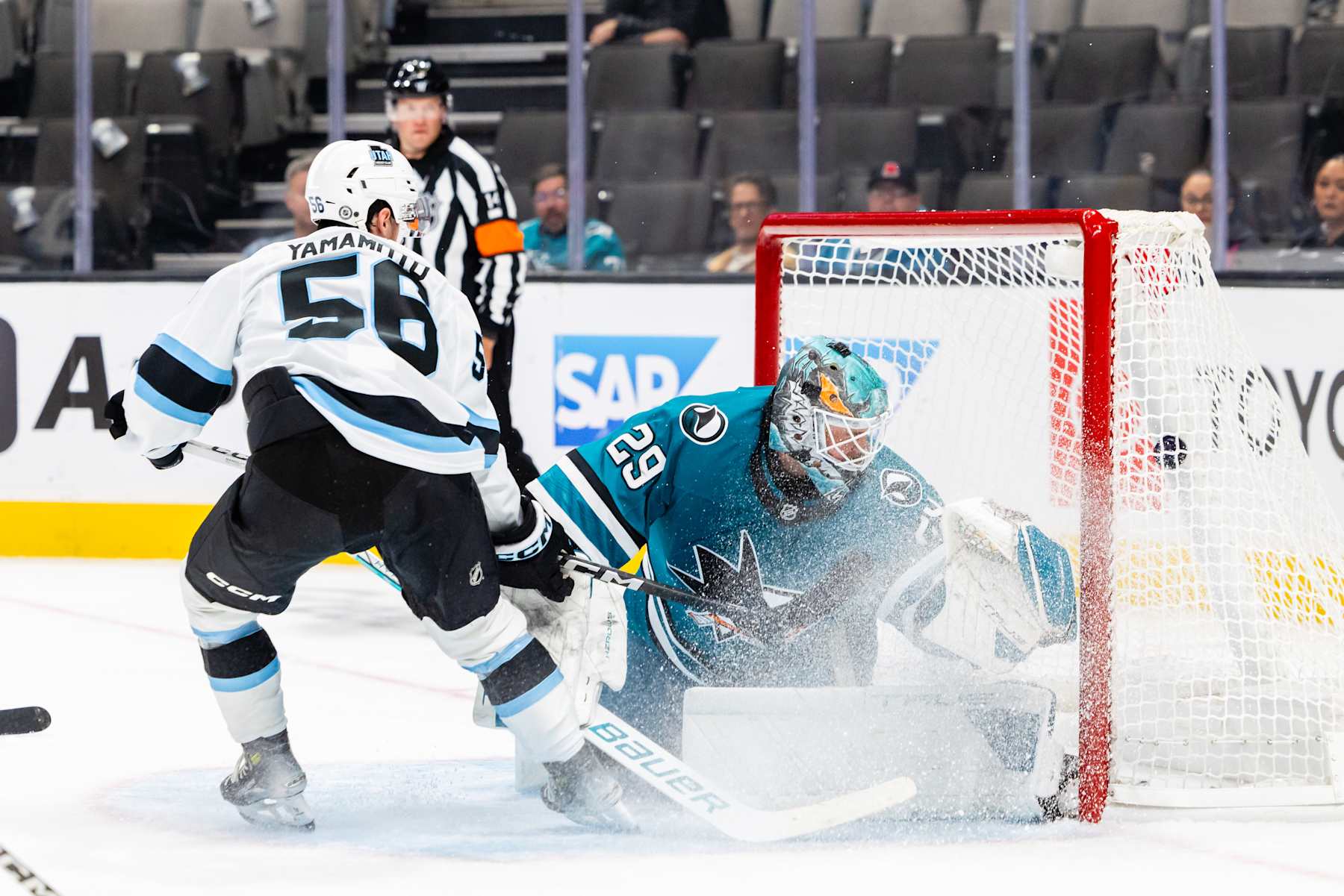 SAN JOSE, CA - OCTOBER 01: Utah Hockey Club right wing Kailer Yamamoto (56) scores a goal against San Jose Sharks goaltender Mackenzie Blackwood (29) during a preseason NHL game between the Utah Hockey Club and the San Jose Sharks on October 1, 2024 at SAP Center at San Jose in San Jose, CA. (Photo by Matthew Huang/Icon Sportswire via Getty Images)