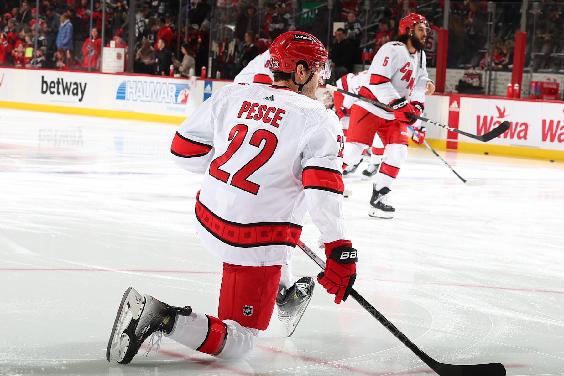 NEWARK, NJ - MARCH 09: Brett Pesce #22 of the Carolina Hurricanes warms up prior to the game against the New Jersey Devils at the Prudential Center on March 9, 2024 in Newark, New Jersey. (Photo by Rich Graessle/NHLI via Getty Images)