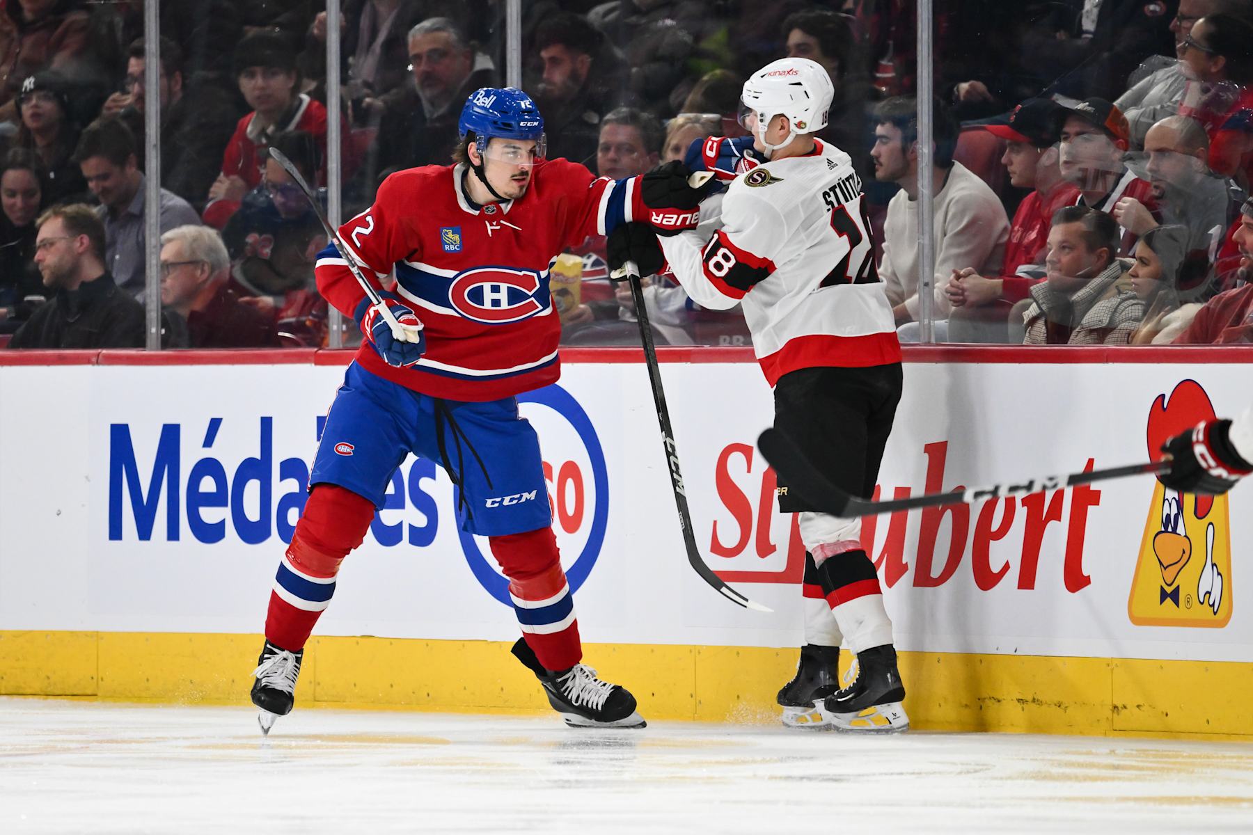 MONTREAL, CANADA - JANUARY 23: Arber Xhekaj #72 of the Montreal Canadiens holds back Tim Stutzle #18 of the Ottawa Senators during the second period at the Bell Centre on January 23, 2024 in Montreal, Quebec, Canada. (Photo by Minas Panagiotakis/Getty Images)