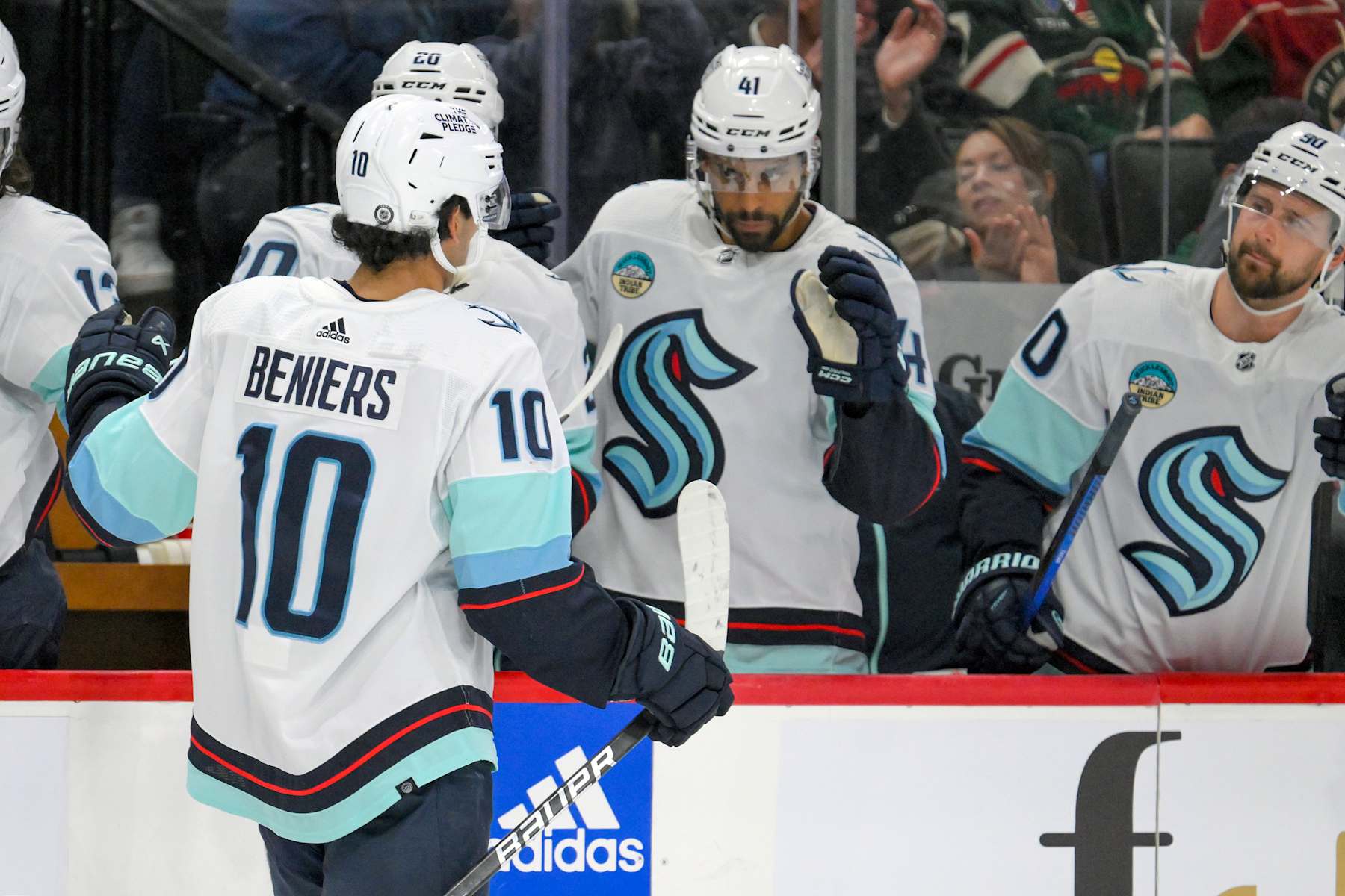 ST. PAUL, MN - APRIL 18: Seattle Kraken forward Matty Beniers (10) celebrates his power play goal during the second period of an NHL game between the Minnesota Wild and Seattle Kraken on April 18, 2024, at Xcel Energy Center in St. Paul, MN. (Photo by Nick Wosika/Icon Sportswire via Getty Images)