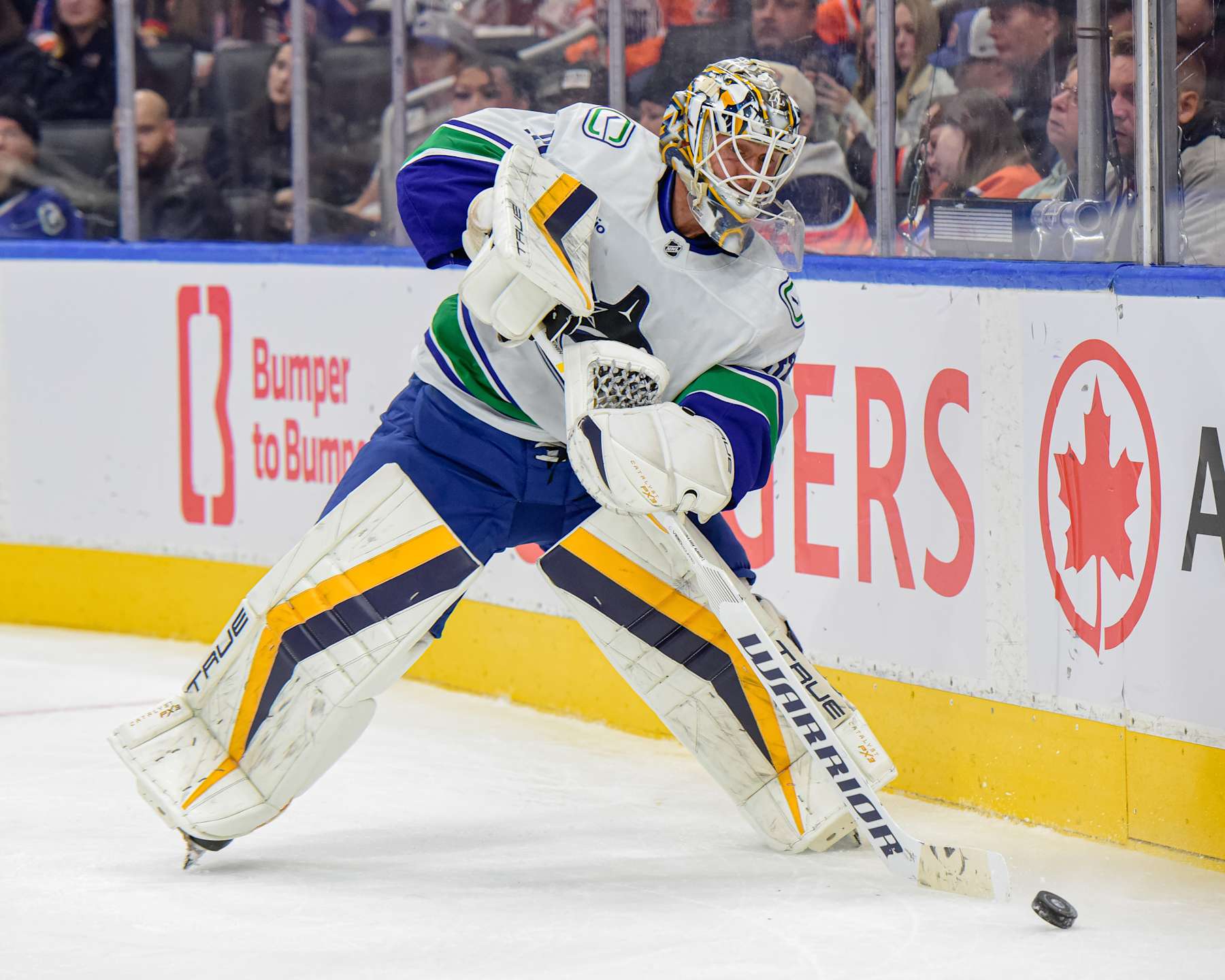 EDMONTON, CANADA SEPTEMBER 30: Kevin Lankinen #32 of the Vancouver Canucks plays the puck behind his net in the second period of a preseason game at Rogers Place on September 30, 2024, in Edmonton, Alberta, Canada. (Photo by Leila Devlin/Getty Images)