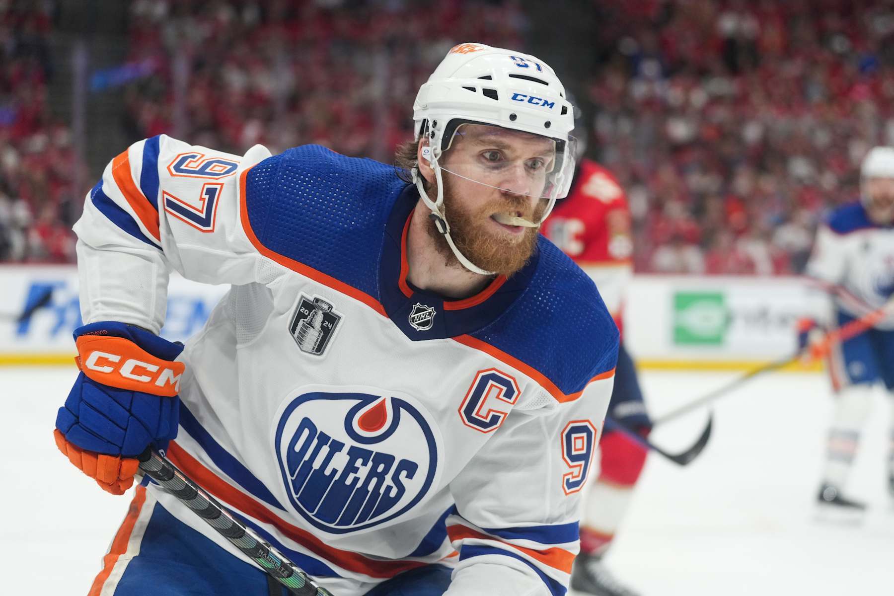 SUNRISE, FL - JUNE 24: Edmonton Oilers center Connor McDavid (97) collects a loose puck in the first period during game seven of the Stanley Cup Finals between the Edmonton Oilers and the Florida Panthers on Monday, June 24, 2024 at Amerant Bank Arena in Sunrise, Fla. (Photo by Peter Joneleit/Icon Sportswire via Getty Images)