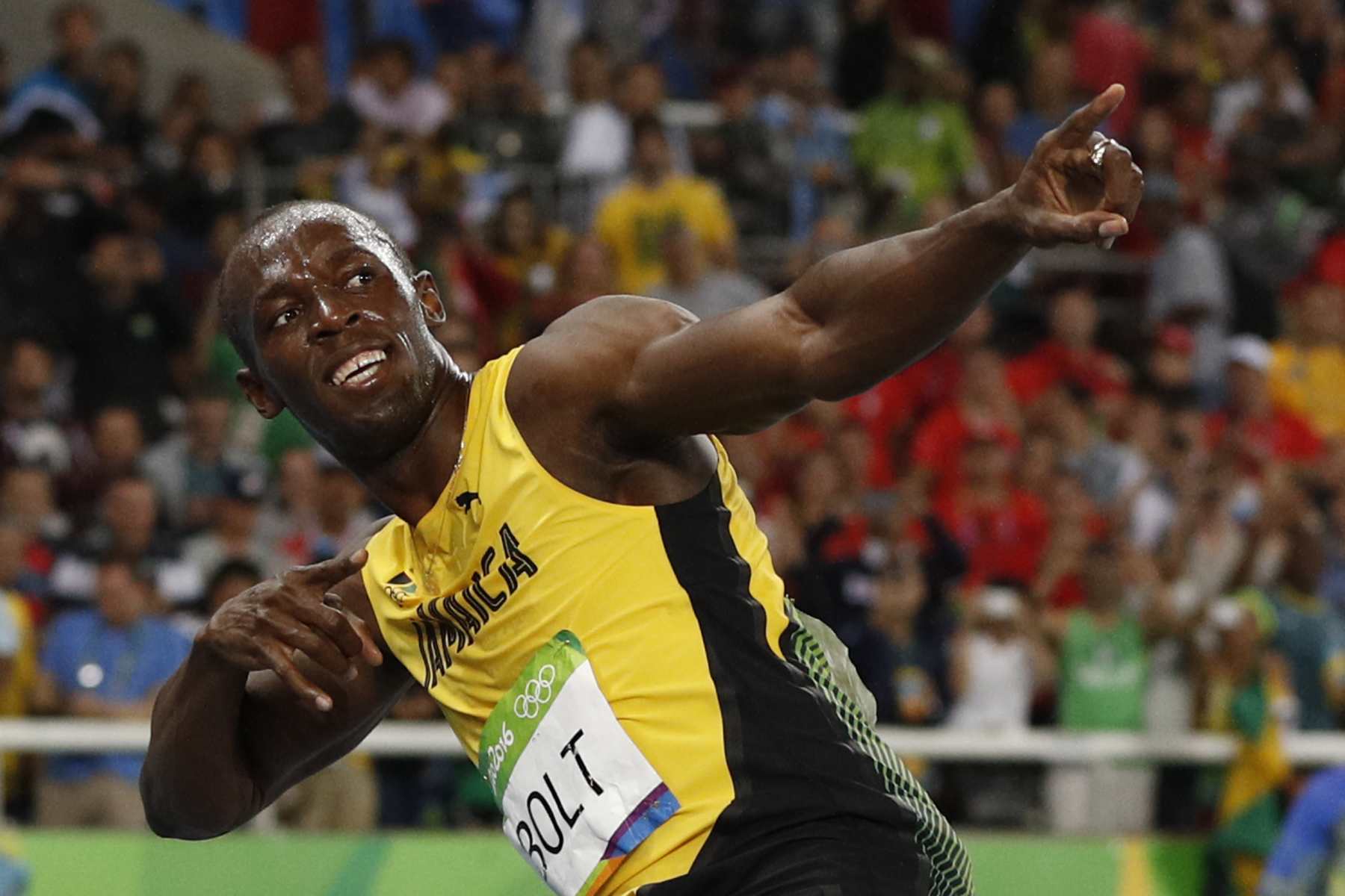 Jamaica's Usain Bolt does his "Lightening Bolt" pose after he won the Men's 200m Final during the athletics event at the Rio 2016 Olympic Games at the Olympic Stadium in Rio de Janeiro on August 18, 2016. / AFP PHOTO / Adrian DENNIS (Photo credit should read ADRIAN DENNIS/AFP via Getty Images)