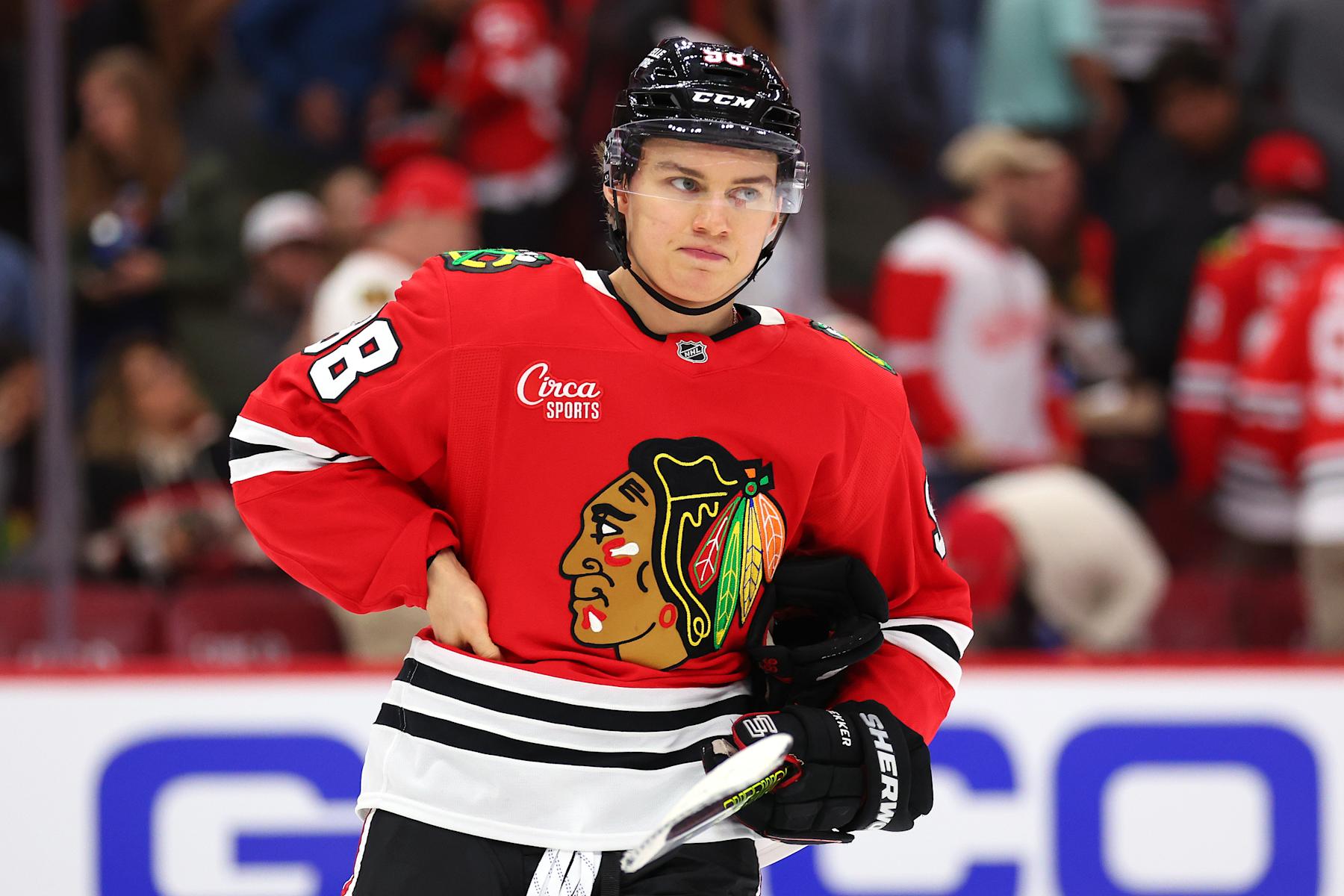 CHICAGO, ILLINOIS - SEPTEMBER 25: Connor Bedard #98 of the Chicago Blackhawks reacts after losing a preseason game against the Detroit Red Wings at the United Center on September 25, 2024 in Chicago, Illinois. (Photo by Michael Reaves/Getty Images)