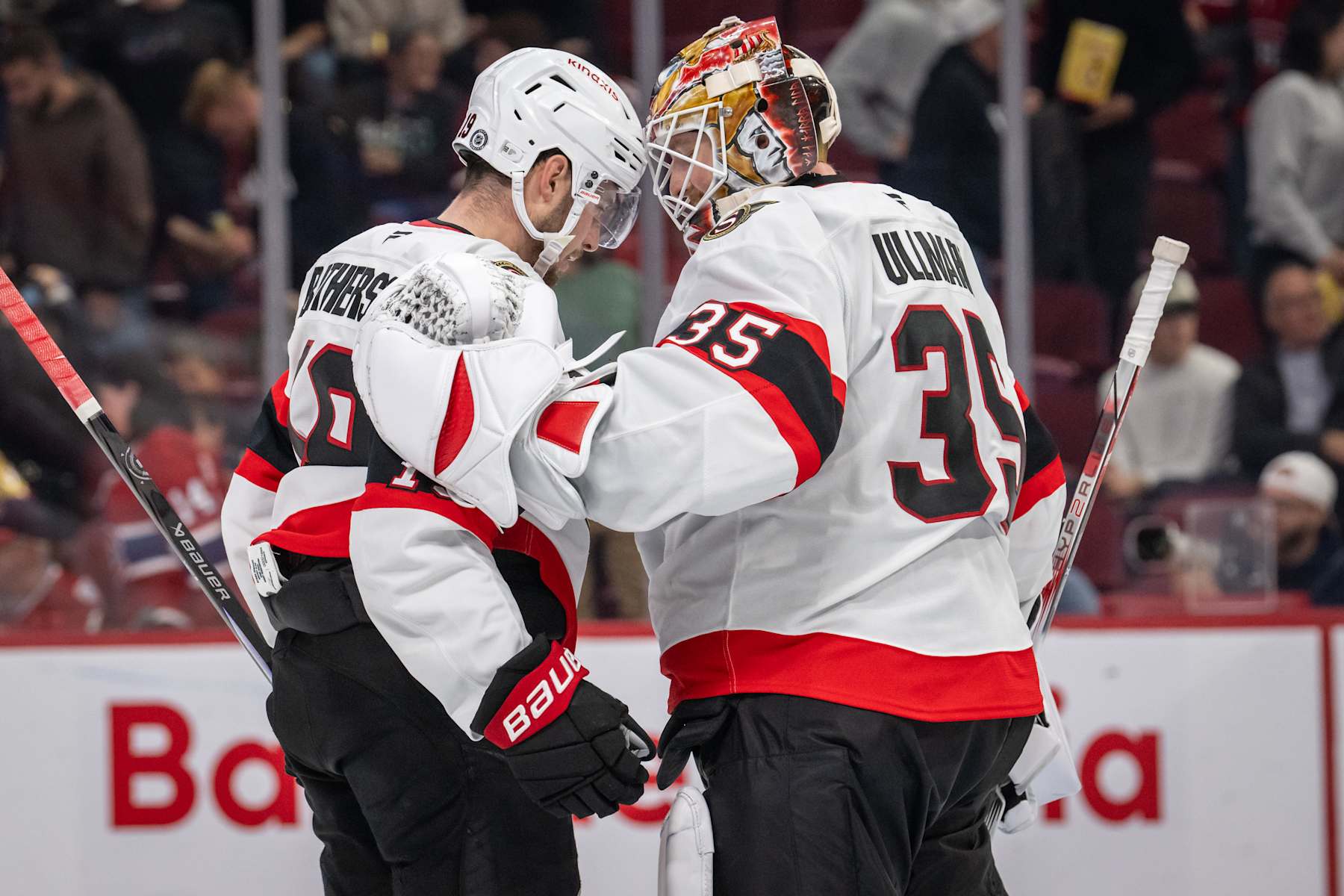 MONTREAL, QC - OCTOBER 01: Drake Batherson (19) of the Ottawa Senators bumps helmets with teammate Linus Ullmark (35) during the third period of the NHL pre-season game between the Ottawa Senators and the Montreal Canadiens on Oct 1, 2024, at the Bell Centre in Montreal, QC(Photo by Vincent Ethier/Icon Sportswire via Getty Images)