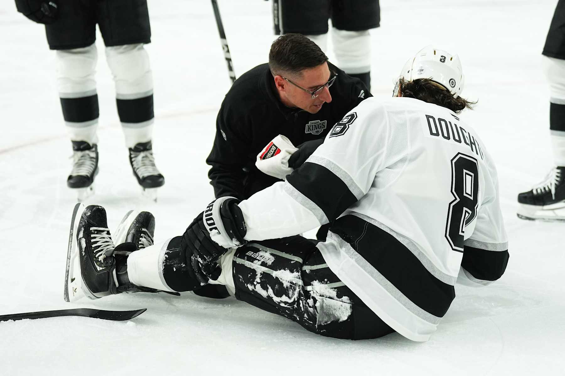 LAS VEGAS, NEVADA - SEPTEMBER 25: Drew Doughty #8 of the Los Angeles Kings reacts after suffering an injury during the first period against the Vegas Golden Knights at T-Mobile Arena on September 25, 2024 in Las Vegas, Nevada. (Photo by Jeff Bottari/NHLI via Getty Images)