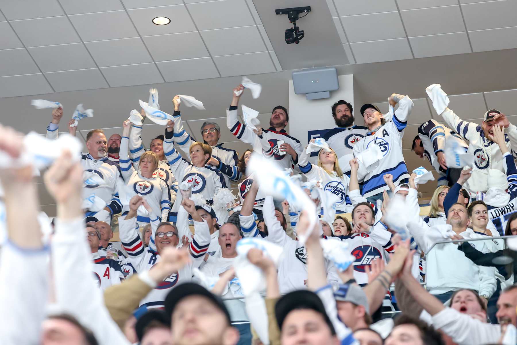 WINNIPEG, CANADA - APRIL 30: Fans cheer and wave white towels as they celebrate a second period goal by the Winnipeg Jets against the Colorado Avalanche in Game Five of the First Round of the 2024 Stanley Cup Playoffs at the Canada Life Centre on April 30, 2024 in Winnipeg, Manitoba, Canada. (Photo by Jonathan Kozub/NHLI via Getty Images)