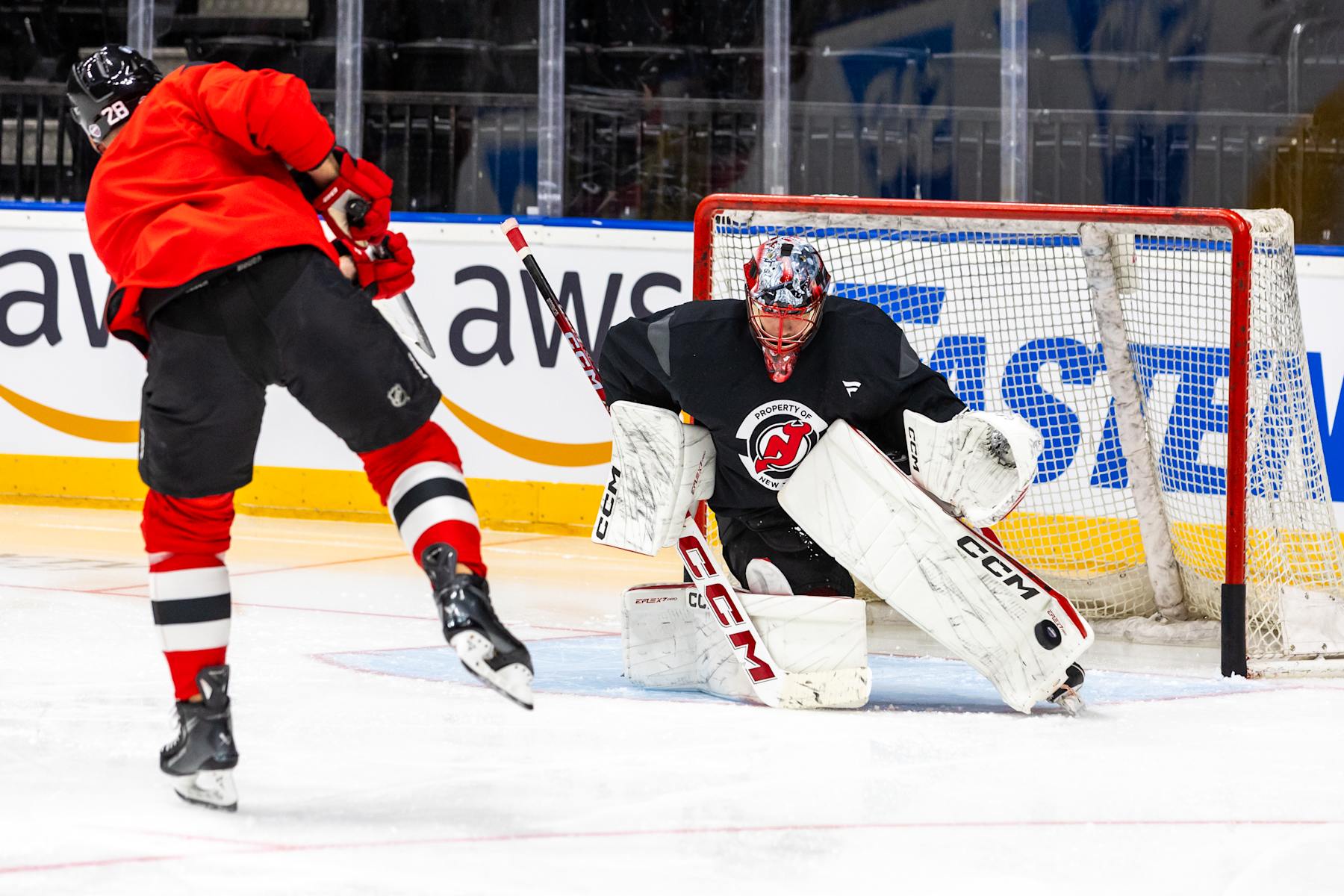 PRAGUE, CZECH REPUBLIC - OCTOBER 3: Jacob Markstrom #25 of the New Jersey Devils makes a save against Timo Meier #28 during practice prior to the 2024 NHL Global Series Challenge at O2 Arena on October 3, 2024 in Prague, Czech Republic. (Photo by Andrew Maclean/NHLI via Getty Images)