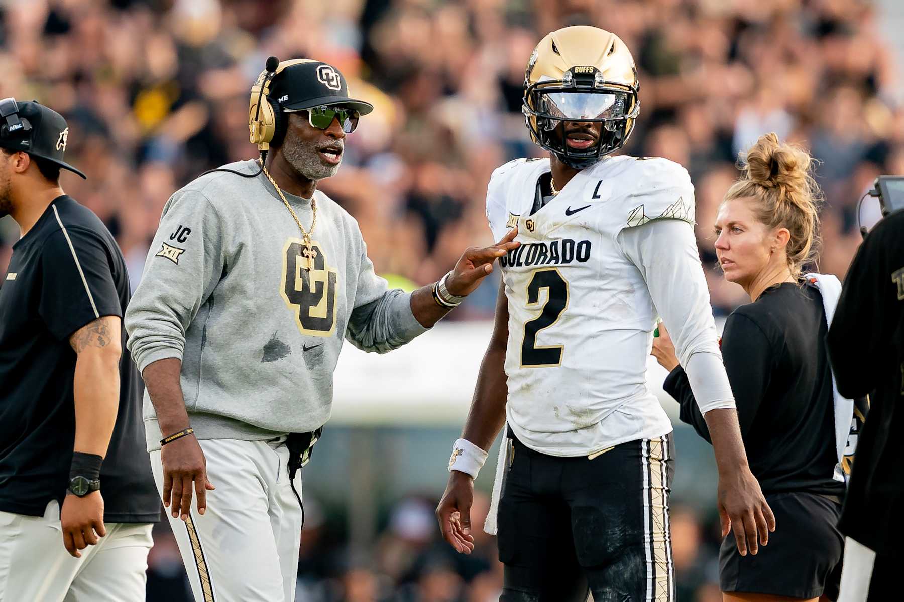 ORLANDO, FL - SEPTEMBER 28:  Colorado Buffaloes head coach Deion Sanders and Colorado Buffaloes quarterback Shedeur Sanders (2) talk during a college football game between the Colorado Buffaloes and the UCF Knights on September 28th, 2024 at FBC Mortgage Stadium in Orlando, FL. (Photo by Chris Leduc/Icon Sportswire via Getty Images)