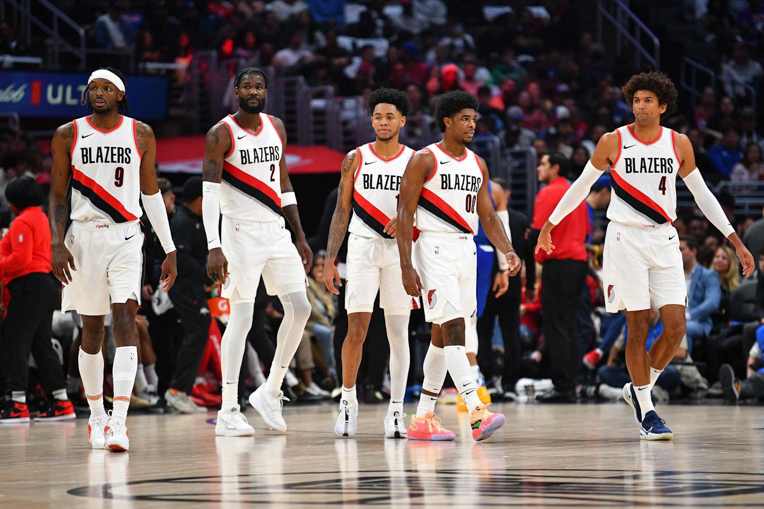 LOS ANGELES, CA - OCTOBER 25: Portland Trail Blazers forward Jerami Grant (9), Portland Trail Blazers center DeAndre Ayton (2), Portland Trail Blazers guard Anfernee Simons (1), Portland Trail Blazers guard Scoot Henderson (00) and Portland Trail Blazers forward Matisse Thybulle (4) look on during a NBA game between the Portland Trail Blazers and the Los Angeles Clippers on October 25, 2023 at Crypto.com Arena in Los Angeles, CA. (Photo by Brian Rothmuller/Icon Sportswire via Getty Images)