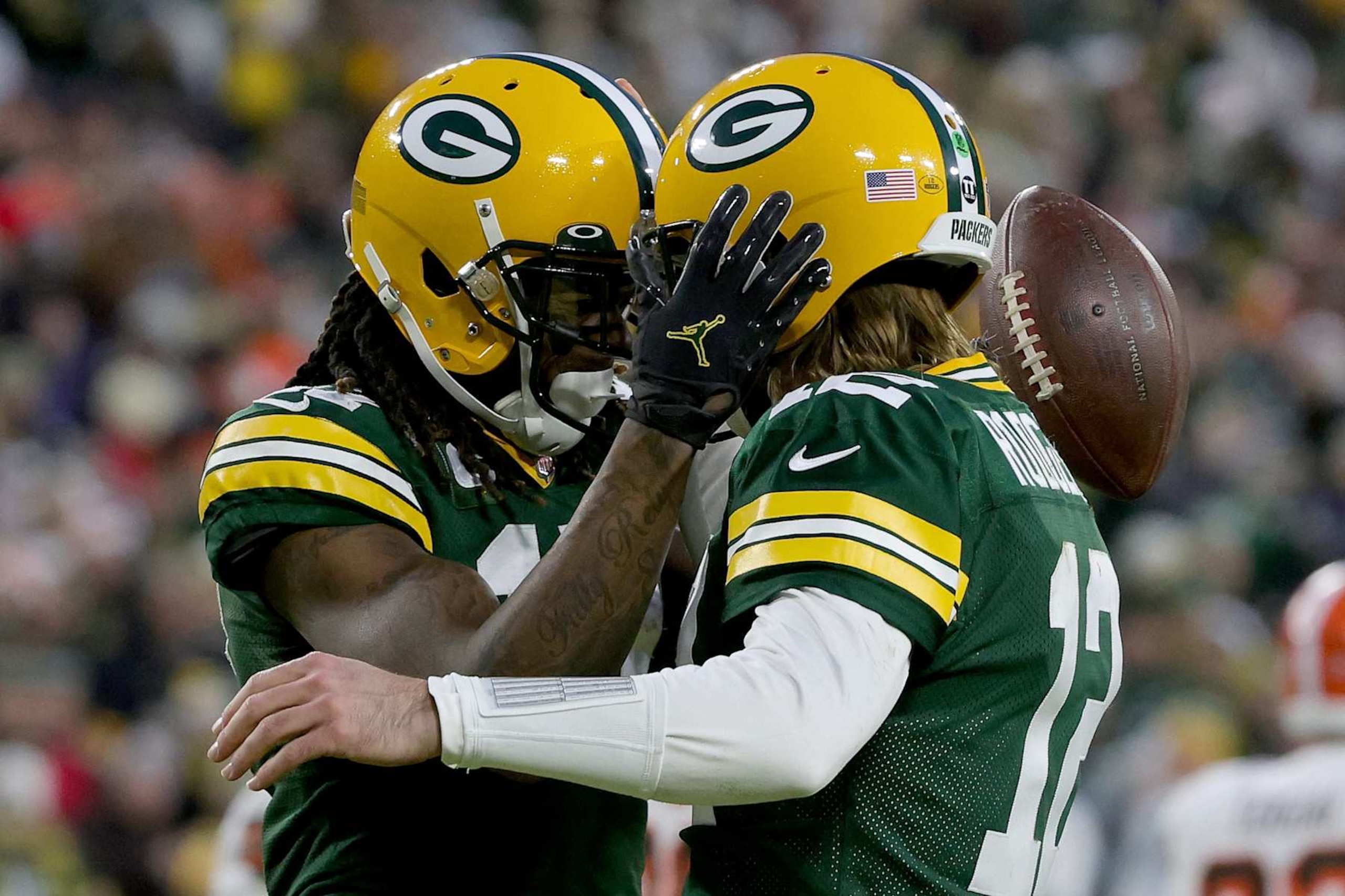 GREEN BAY, WISCONSIN - DECEMBER 25: Davante Adams #17 and Aaron Rodgers #12 of the Green Bay Packers celebrate after scoring a touchdown in the second quarter against the Cleveland Browns at Lambeau Field on December 25, 2021 in Green Bay, Wisconsin. (Photo by Stacy Revere/Getty Images)