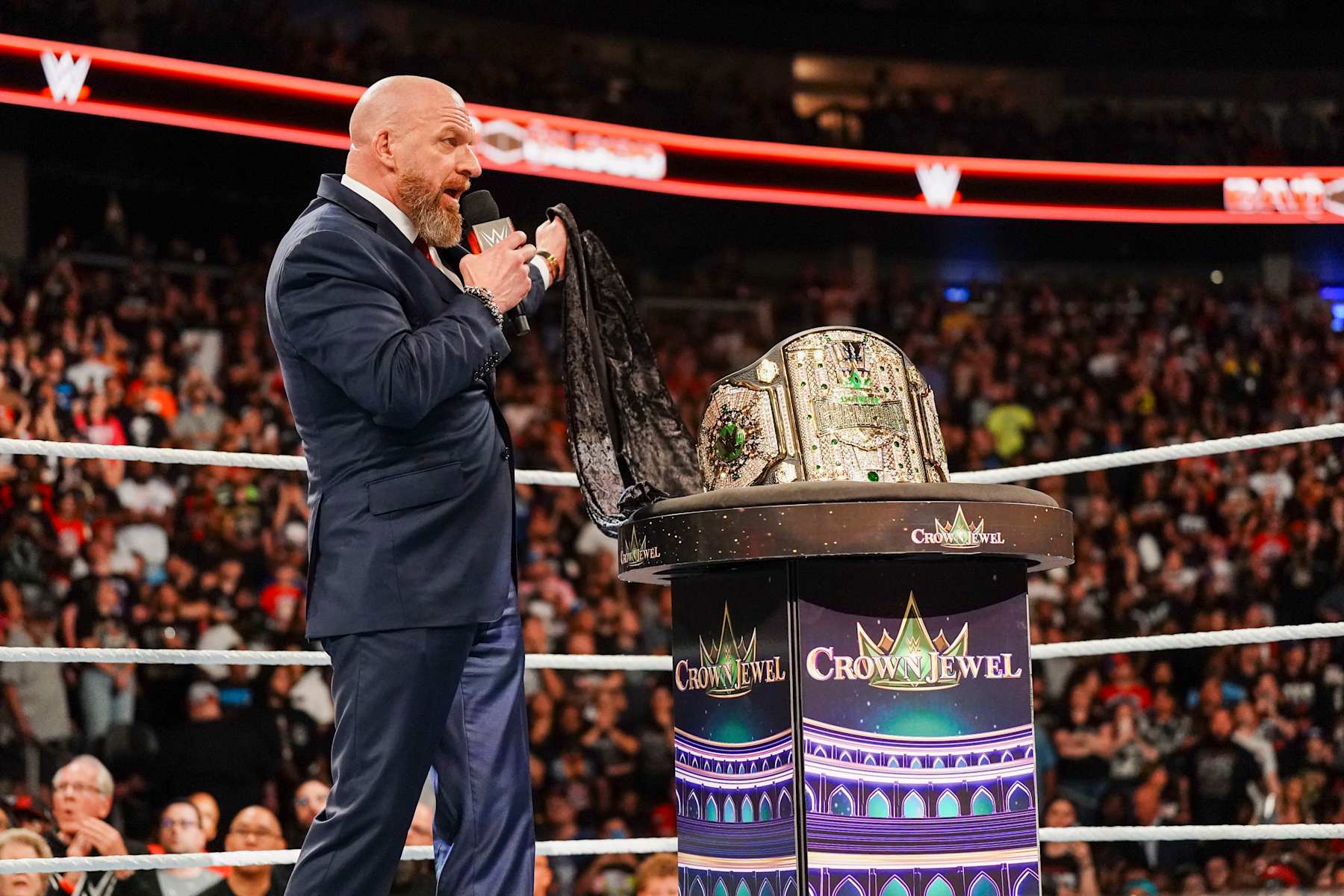 ATLANTA, GEORGIA - OCTOBER 5: Triple H presents the Crown Jewel title belt during Bad Blood at State Farm Arena on October 5, 2024 in Atlanta, Georgia. (Photo by WWE/Getty Images)