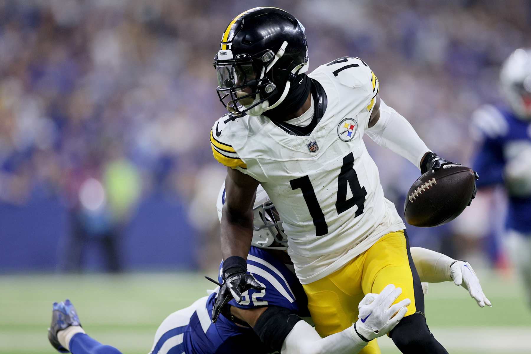 INDIANAPOLIS, INDIANA - SEPTEMBER 29: George Pickens (14) of the Pittsburgh Steelers is tackled by Julian Blackmon (32) of the Indianapolis Colts at Lucas Oil Stadium on September 29, 2024 in Indianapolis, Indiana. (Photo by Andy Lyons/Getty Images)