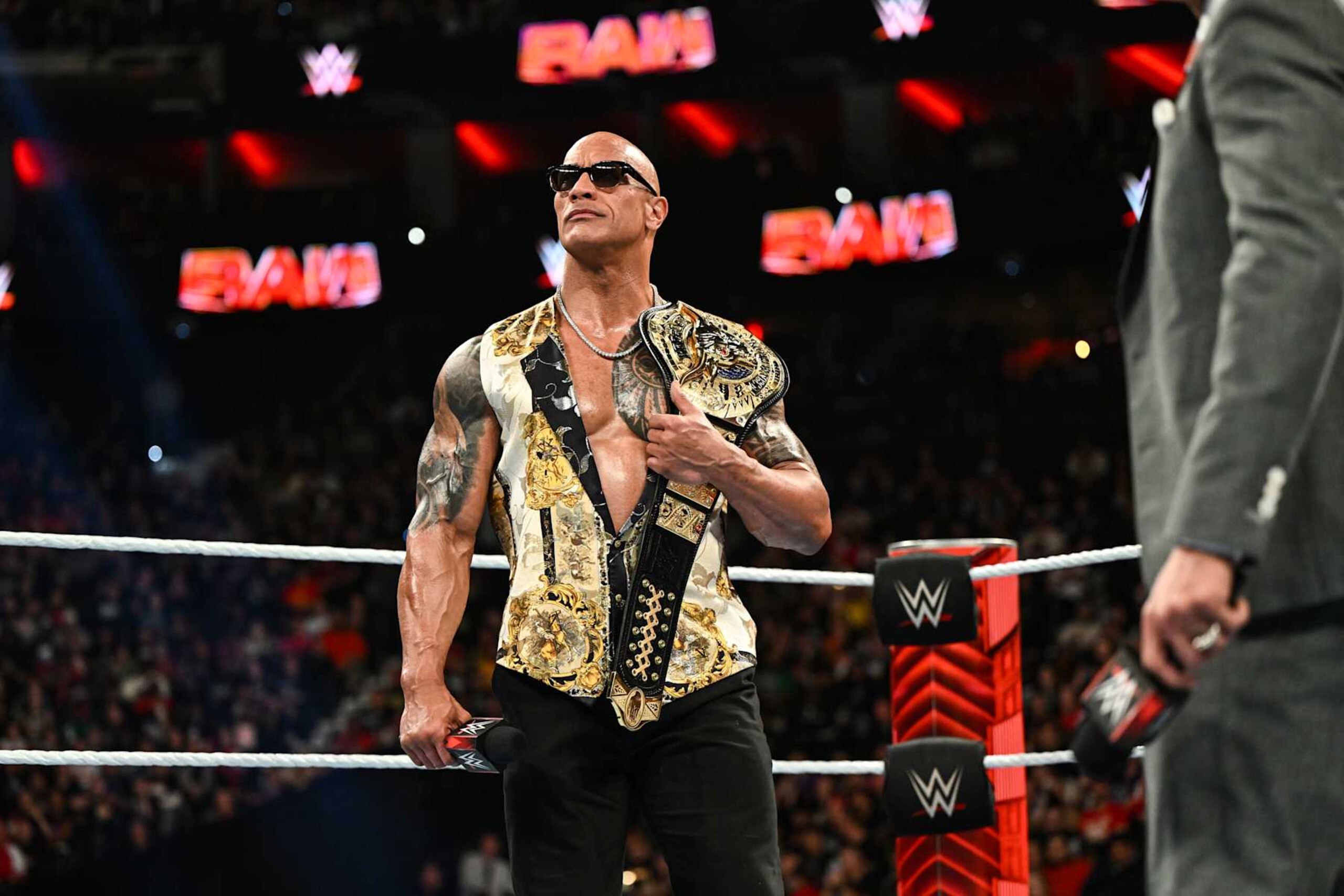 PHILADELPHIA, PENNSYLVANIA - APRIL 08: Dwayne "The Rock" Johnson stands in ring at the Wells Fargo Center on April 8, 2024 in Philadelphia, Pennsylvania. (Photo by WWE/Getty Images)