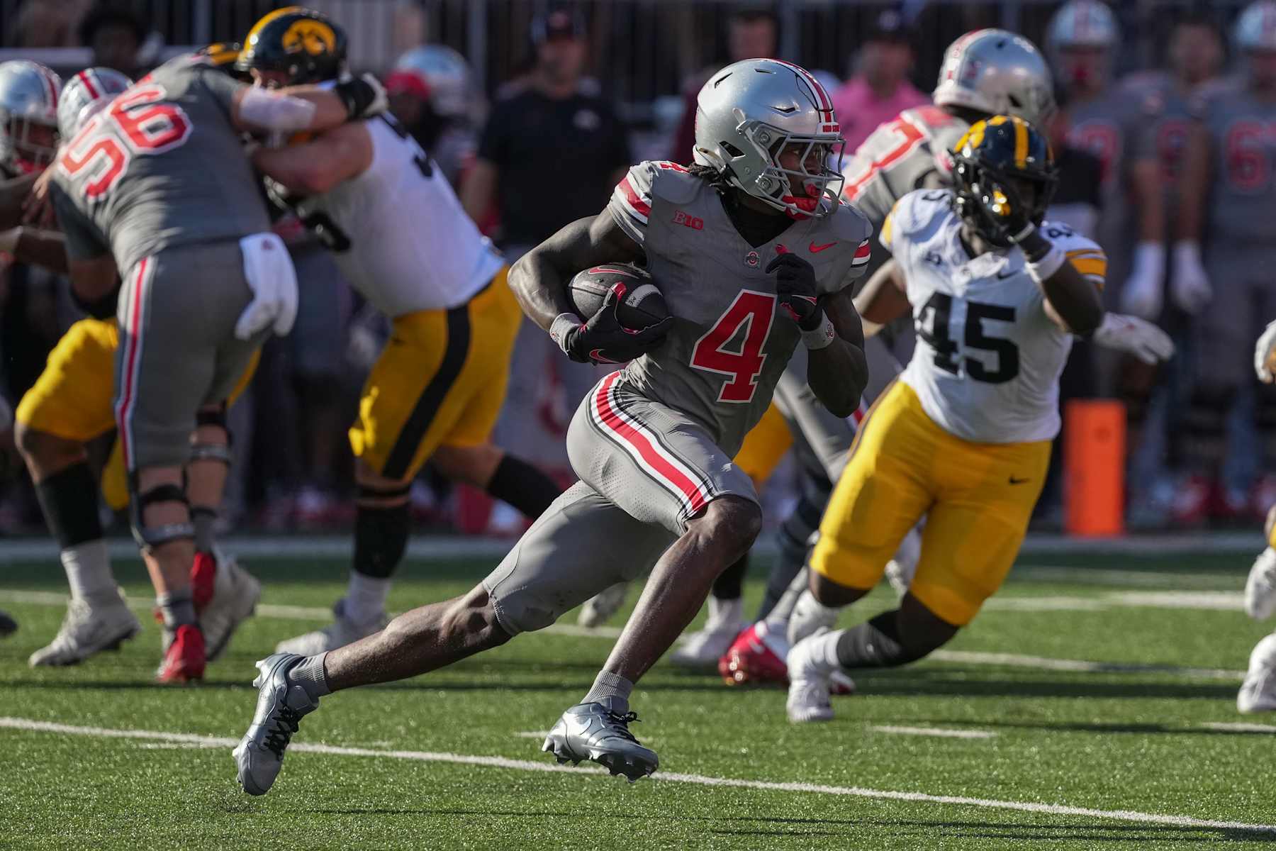 COLUMBUS, OHIO - OCTOBER 05: Wide receiver Jeremiah Smith #4 of the Ohio State Buckeyes carries the ball against the Iowa Hawkeyes during the second quarter at Ohio Stadium on October 05, 2024 in Columbus, Ohio. (Photo by Jason Mowry/Getty Images) COLUMBUS, OHIO - OCTOBER 05: Wide receiver Jeremiah Smith #4 of the Ohio State Buckeyes carries the ball against the Iowa Hawkeyes during the second quarter at Ohio Stadium on October 05, 2024 in Columbus, Ohio. (Photo by Jason Mowry/Getty Images)