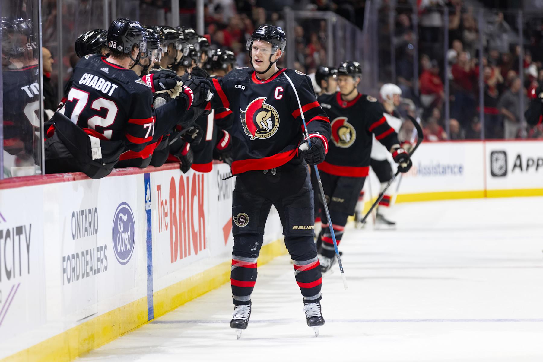 OTTAWA, ON - APRIL 06: Ottawa Senators Left Wing Brady Tkachuk (7) skates by the bench to celebrate his goal during third period National Hockey League action between the New Jersey Devils and Ottawa Senators on April 6, 2024, at Canadian Tire Centre in Ottawa, ON, Canada. (Photo by Richard A. Whittaker/Icon Sportswire via Getty Images)