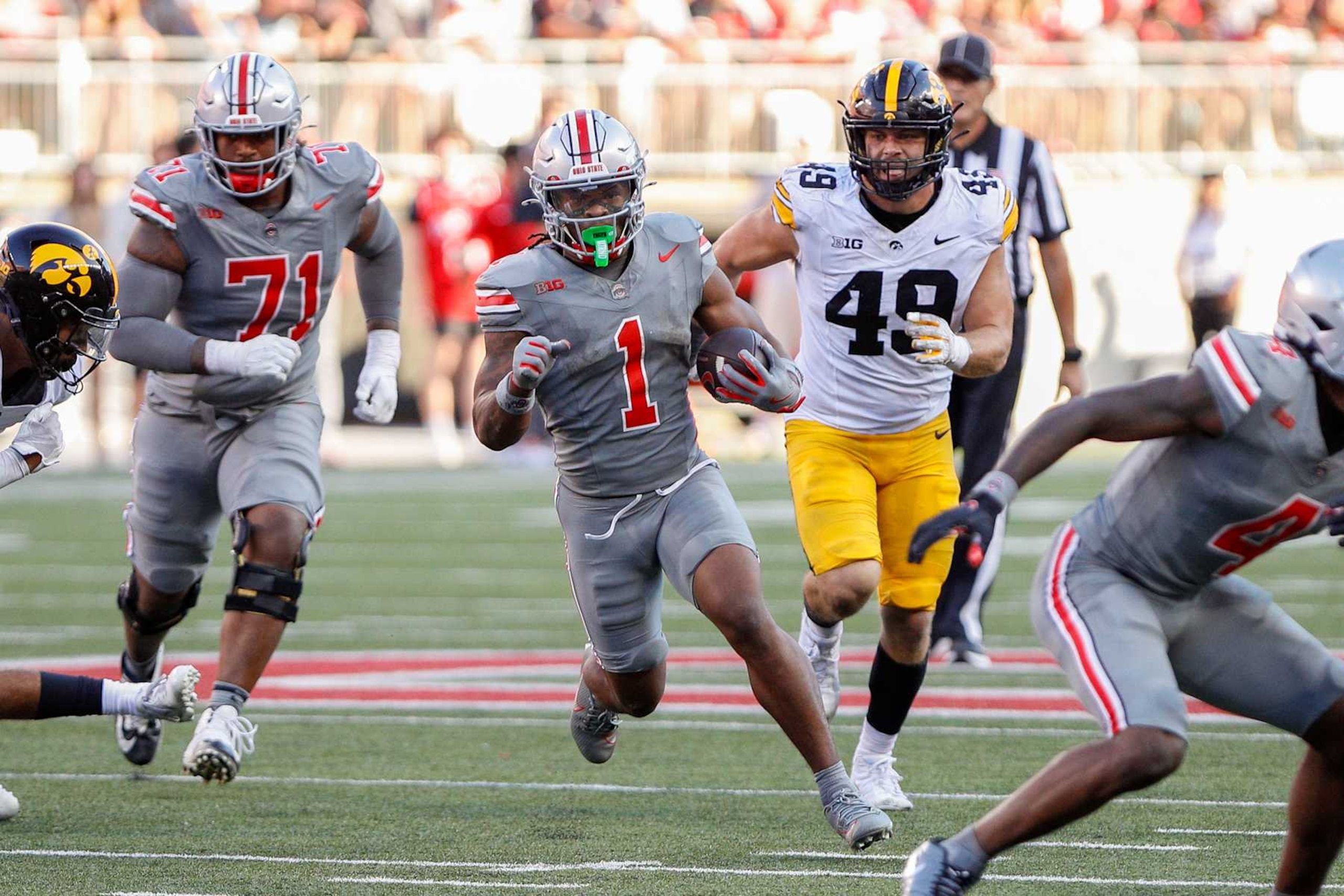 COLUMBUS, OH - OCTOBER 05: Ohio State Buckeyes running back Quinshon Judkins (1) carries the ball during the game against the Iowa Hawkeyes and the Ohio State Buckeyes on October 5, 2024, at Ohio Stadium in Columbus, OH. (Photo by Ian Johnson/Icon Sportswire via Getty Images)