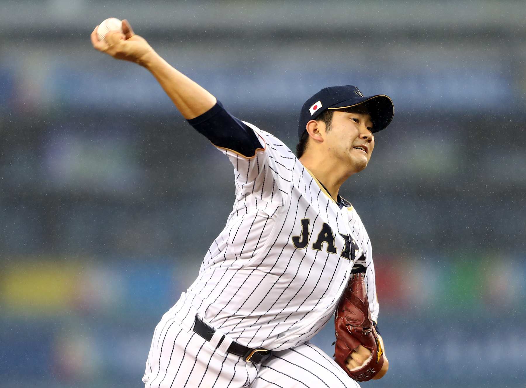 LOS ANGELES, CA - MARCH 21: Tomoyuki Sugano #11 of Team Japan pitches during Game 2 of the Championship Round of the 2017 World Baseball Classic against Team USA on Tuesday, March 21, 2017 at Dodger Stadium in Los Angeles, California. (Photo by Alex Trautwig/WBCI/MLB via Getty Images)