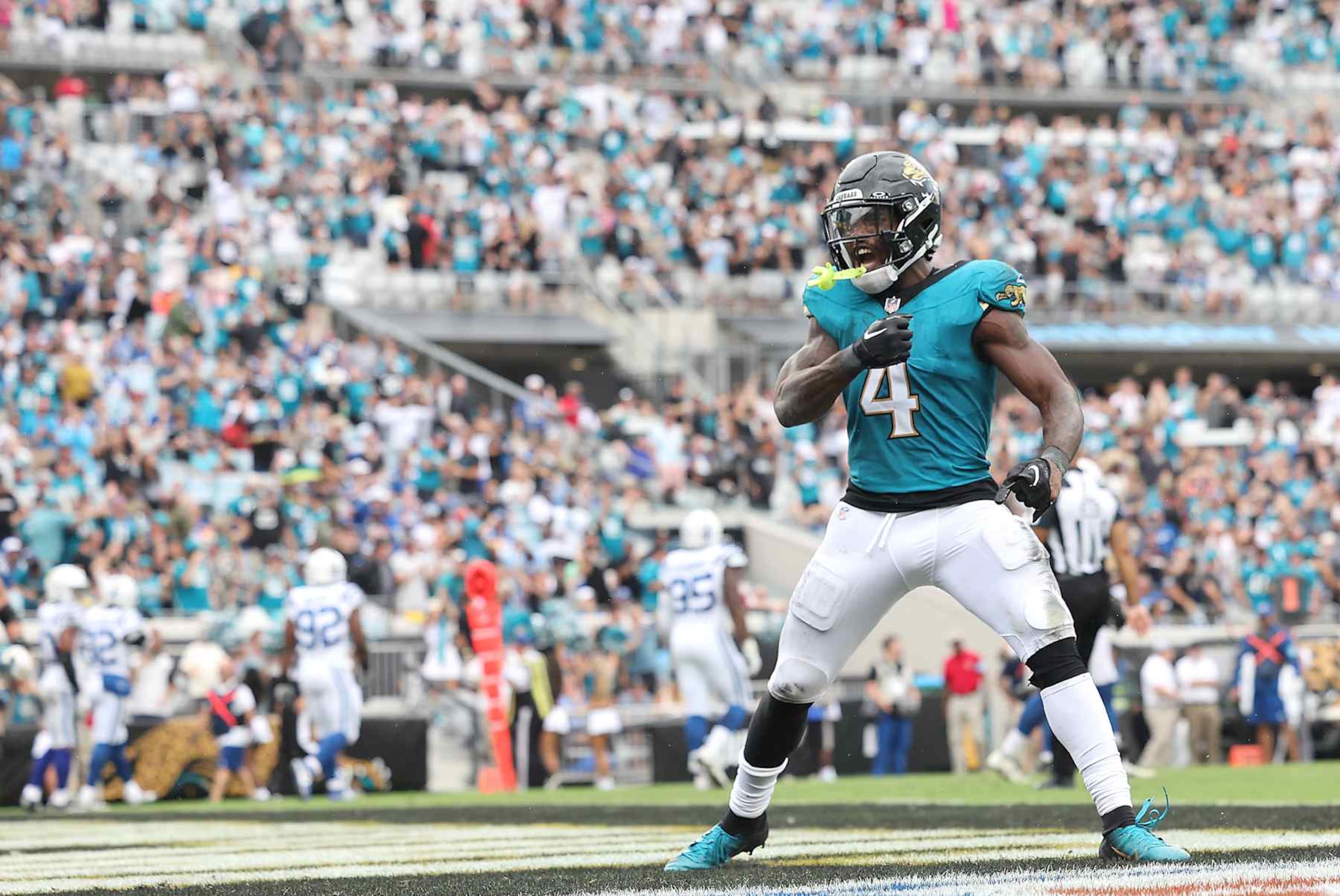 JACKSONVILLE, FLORIDA - OCTOBER 06: Tank Bigsby #4 celebrates a touchdown run during the third quarter against the Indianapolis Colts at EverBank Stadium on October 06, 2024 in Jacksonville, Florida. (Photo by Mike Carlson/Getty Images)