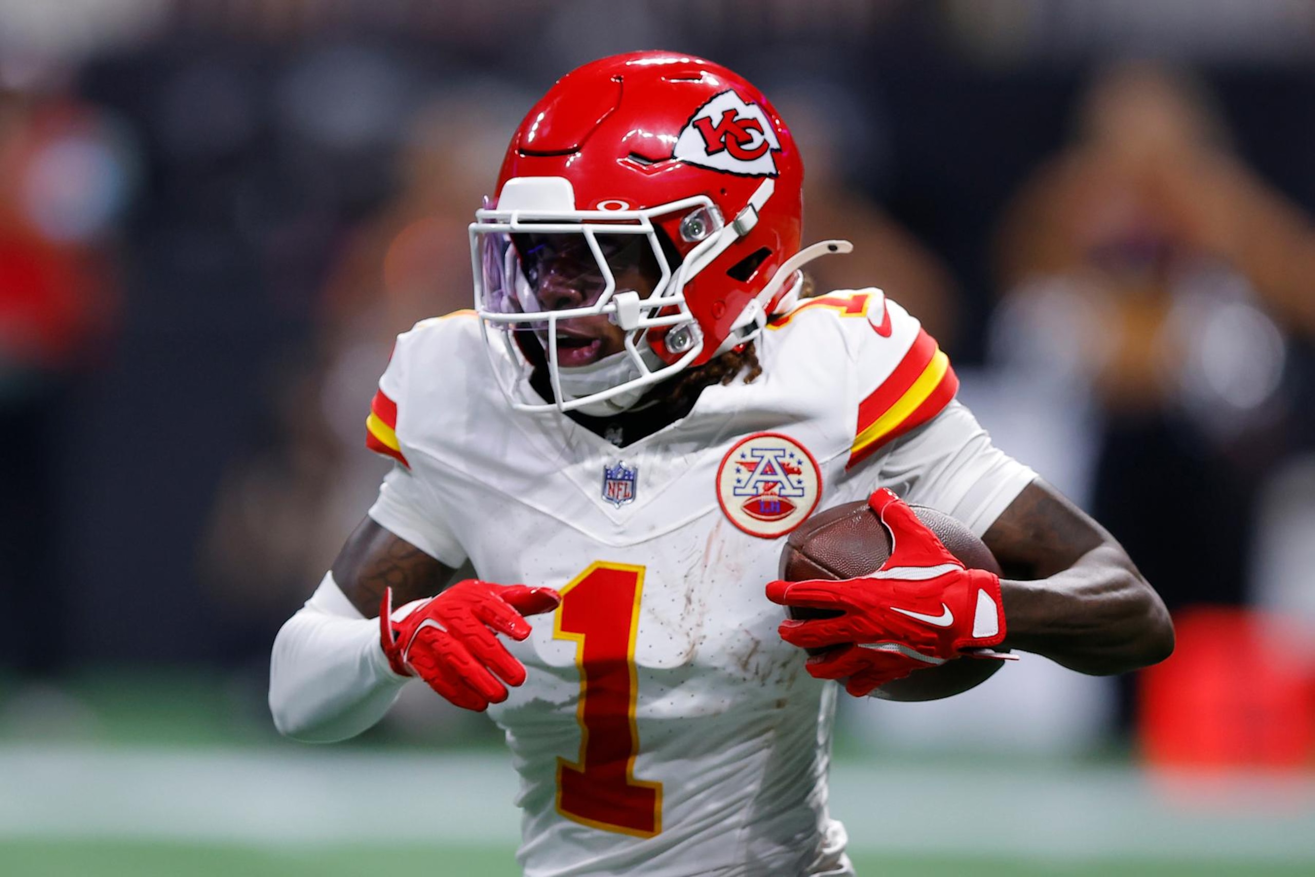 ATLANTA, GEORGIA - SEPTEMBER 22: Xavier Worthy #1 of the Kansas City Chiefs runs the ball after a catch during the first quarter against the Atlanta Falcons at Mercedes-Benz Stadium on September 22, 2024 in Atlanta, Georgia. (Photo by Todd Kirkland/Getty Images)