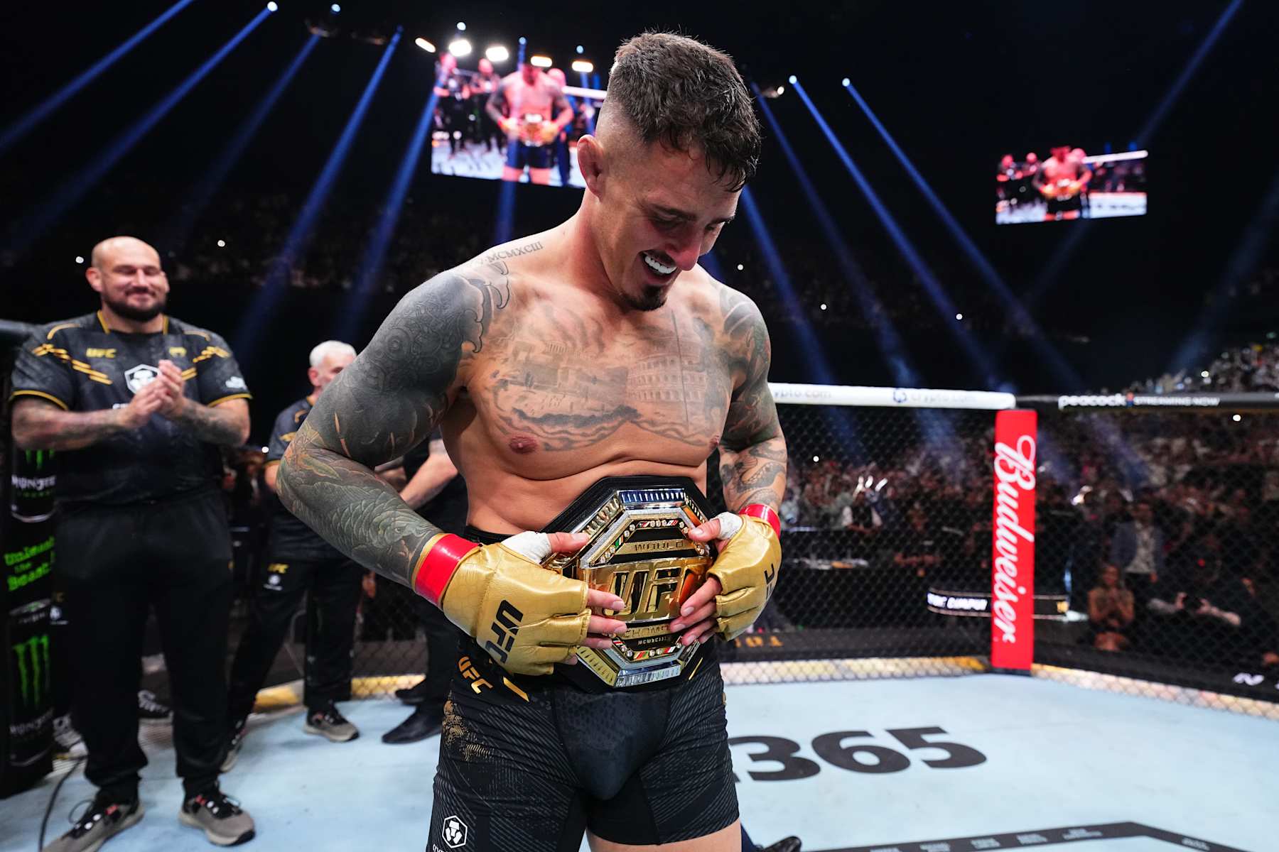 Tom Aspinall of England reacts after his knockout victory against Curtis Blaydes
