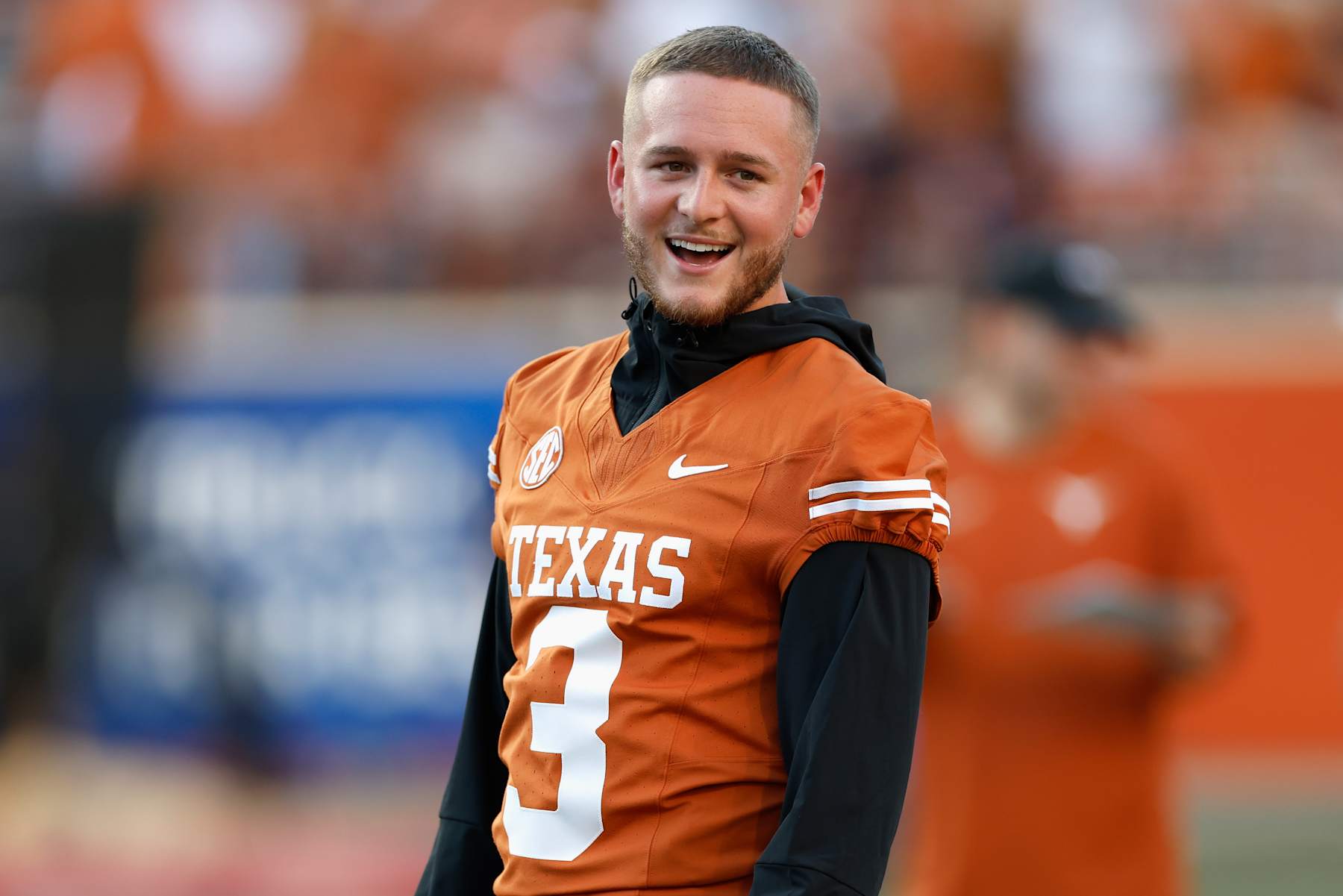 AUSTIN, TEXAS - SEPTEMBER 21: Quinn Ewers #3 of the Texas Longhorns watches teammates warm up before the game against the Louisiana Monroe Warhawks at Darrell K Royal-Texas Memorial Stadium on September 21, 2024 in Austin, Texas. (Photo by Tim Warner/Getty Images)