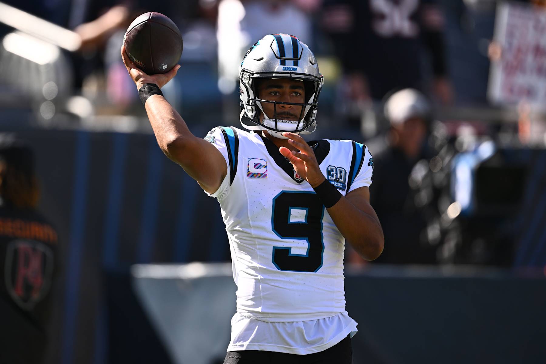 CHICAGO, ILLINOIS - OCTOBER 06: Bryce Young #9 of the Carolina Panthers warms up before the game against the Chicago Bears at Soldier Field on October 06, 2024 in Chicago, Illinois. (Photo by Quinn Harris/Getty Images)