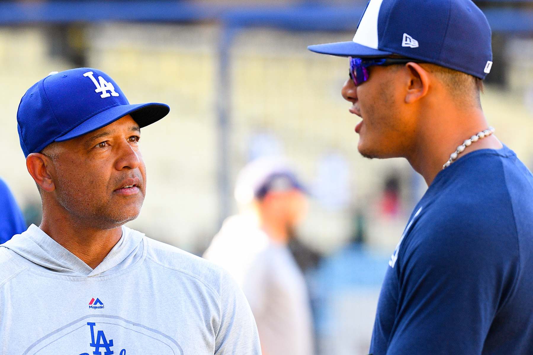 LOS ANGELES, CA - AUGUST 01: San Diego Padres third baseman Manny Machado (13) talks with manager Dave Roberts before a MLB game between the San Diego Padres and the Los Angeles Dodgers on August 1, 2019 at Dodger Stadium in Los Angeles, CA. (Photo by Brian Rothmuller/Icon Sportswire via Getty Images)