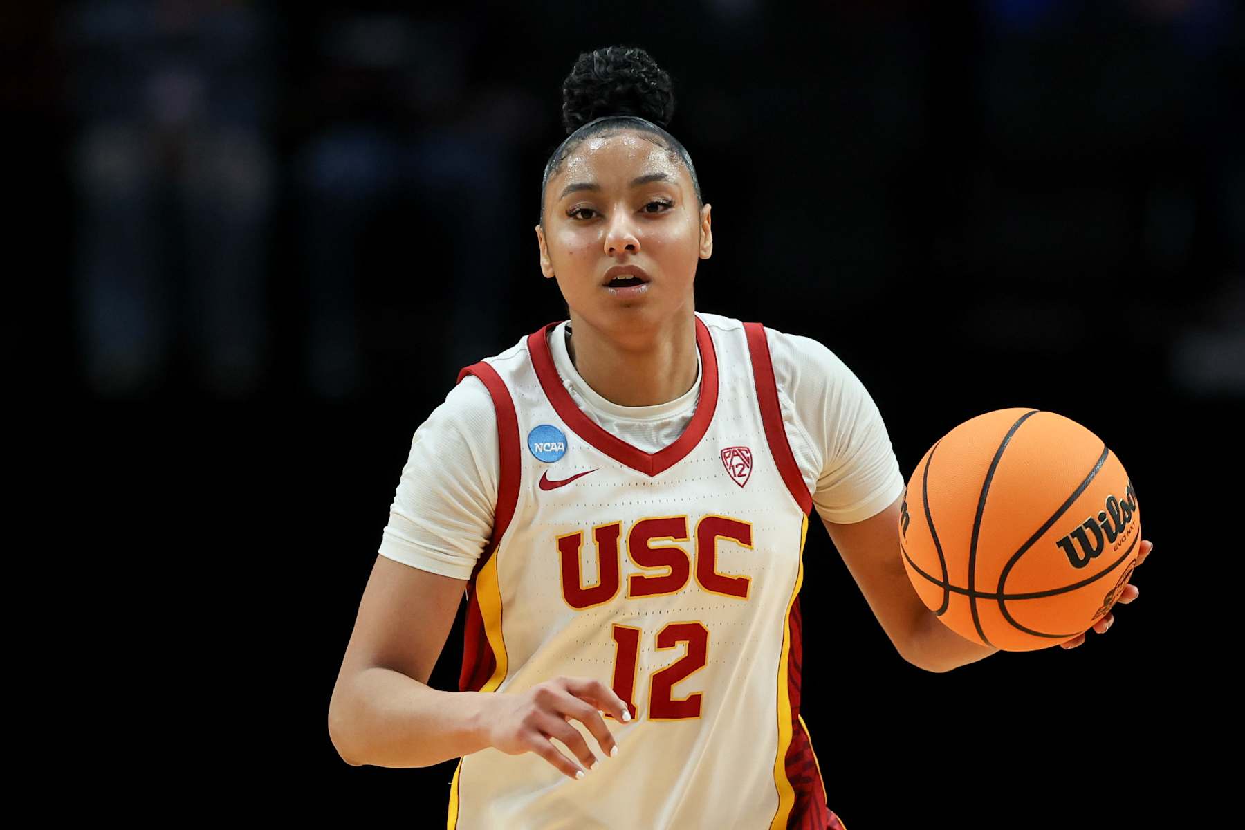 PORTLAND, OREGON - MARCH 30: JuJu Watkins #12 of the USC Trojans dribbles during the first half against the Baylor Lady Bears in the Sweet 16 round of the NCAA Women's Basketball Tournament at Moda Center on March 30, 2024 in Portland, Oregon. (Photo by Steph Chambers/Getty Images)