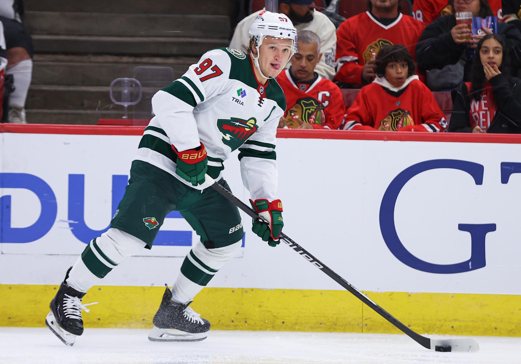 CHICAGO, IL - OCTOBER 04: Minnesota Wild left wing Kirill Kaprizov #97 controls the puck during the second period of a preseason game against the Chicago Blackhawks on October 4, 2024 at the United Center in Chicago,Illinois. (Photo by Melissa Tamez/Icon Sportswire via Getty Images)