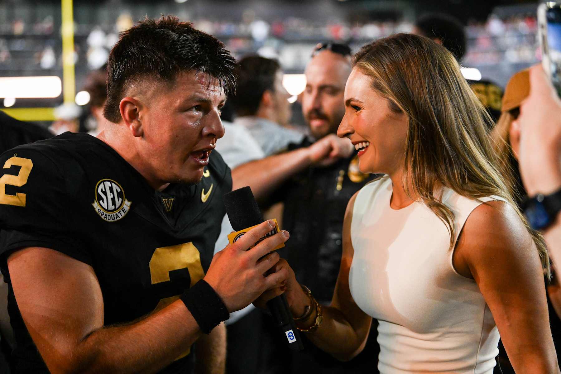 NASHVILLE, TENNESSEE - OCTOBER 5: Diego Pavia #2 of the Vanderbilt Commodores is interviewed by Alyssa Lang after his win against the Alabama Crimson Tide at FirstBank Stadium on October 5, 2024 in Nashville, Tennessee. (Photo by Carly Mackler/Getty Images)