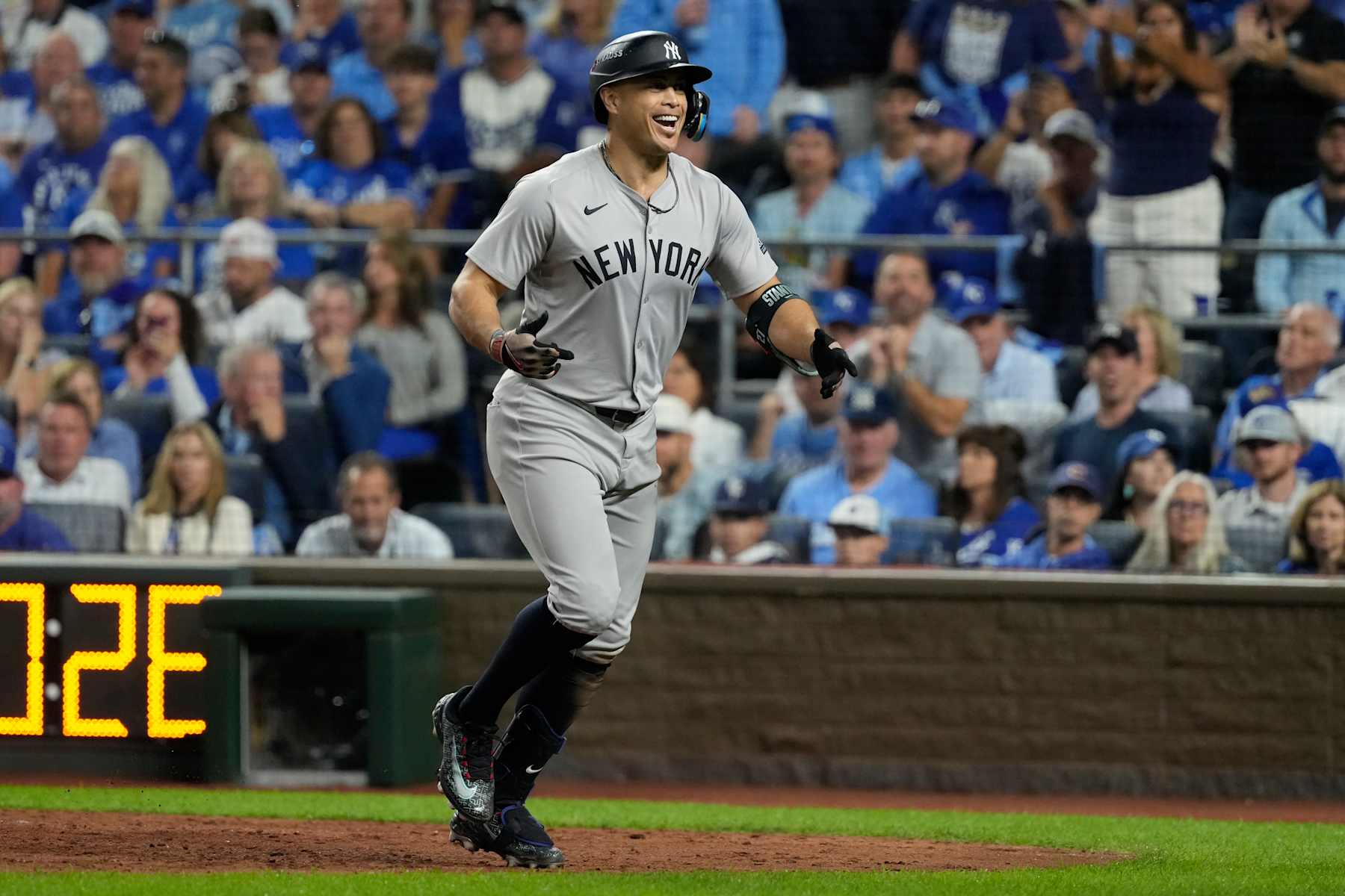 KANSAS CITY, MISSOURI - OCTOBER 09: Giancarlo Stanton #27 of the New York Yankees celebrates after hitting a home run in the eighth inning against the Kansas City Royals during Game Three of the Division Series at Kauffman Stadium on October 09, 2024 in Kansas City, Missouri. (Photo by Ed Zurga/Getty Images)