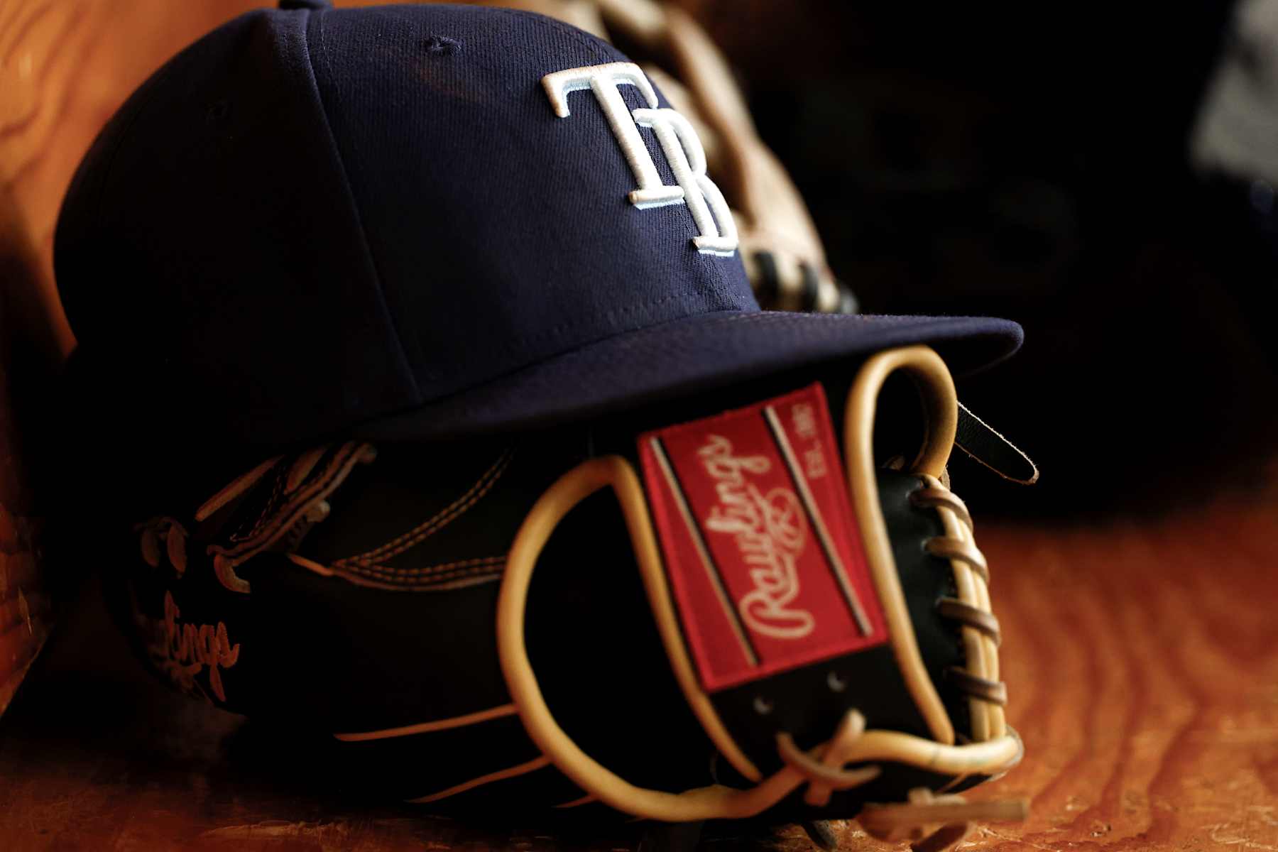 ST PETERSBURG, FLORIDA - JULY 31: Detailed view of a baseball hat and glove during the fourth inning against the Miami Marlins at Tropicana Field on July 31, 2024 in St Petersburg, Florida. (Photo by Douglas P. DeFelice/Getty Images)