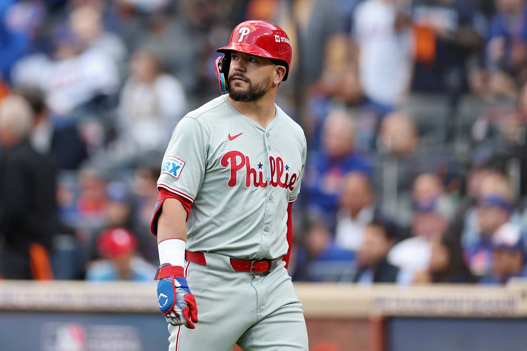 NEW YORK, NEW YORK - OCTOBER 09: Kyle Schwarber #12 of the Philadelphia Phillies walks back to the dugout after striking out in the first inning against the New York Mets during Game Four of the Division Series at Citi Field on October 09, 2024 in New York City. (Photo by Elsa/Getty Images)