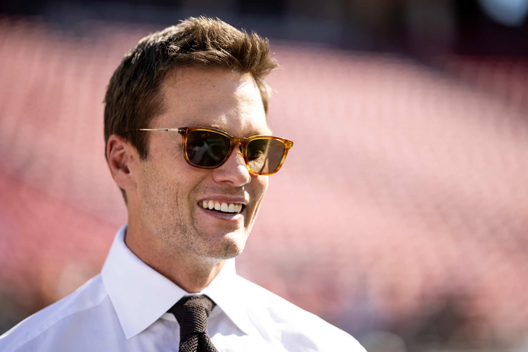 SANTA CLARA, CALIFORNIA - OCTOBER 6: Fox Sports commentator and former NFL quarterback Tom Brady reacts prior to an NFL Football game between the San Francisco 49ers and the Arizona Cardinals at Levi's Stadium on October 06, 2024 in Santa Clara, California. (Photo by Michael Owens/Getty Images)