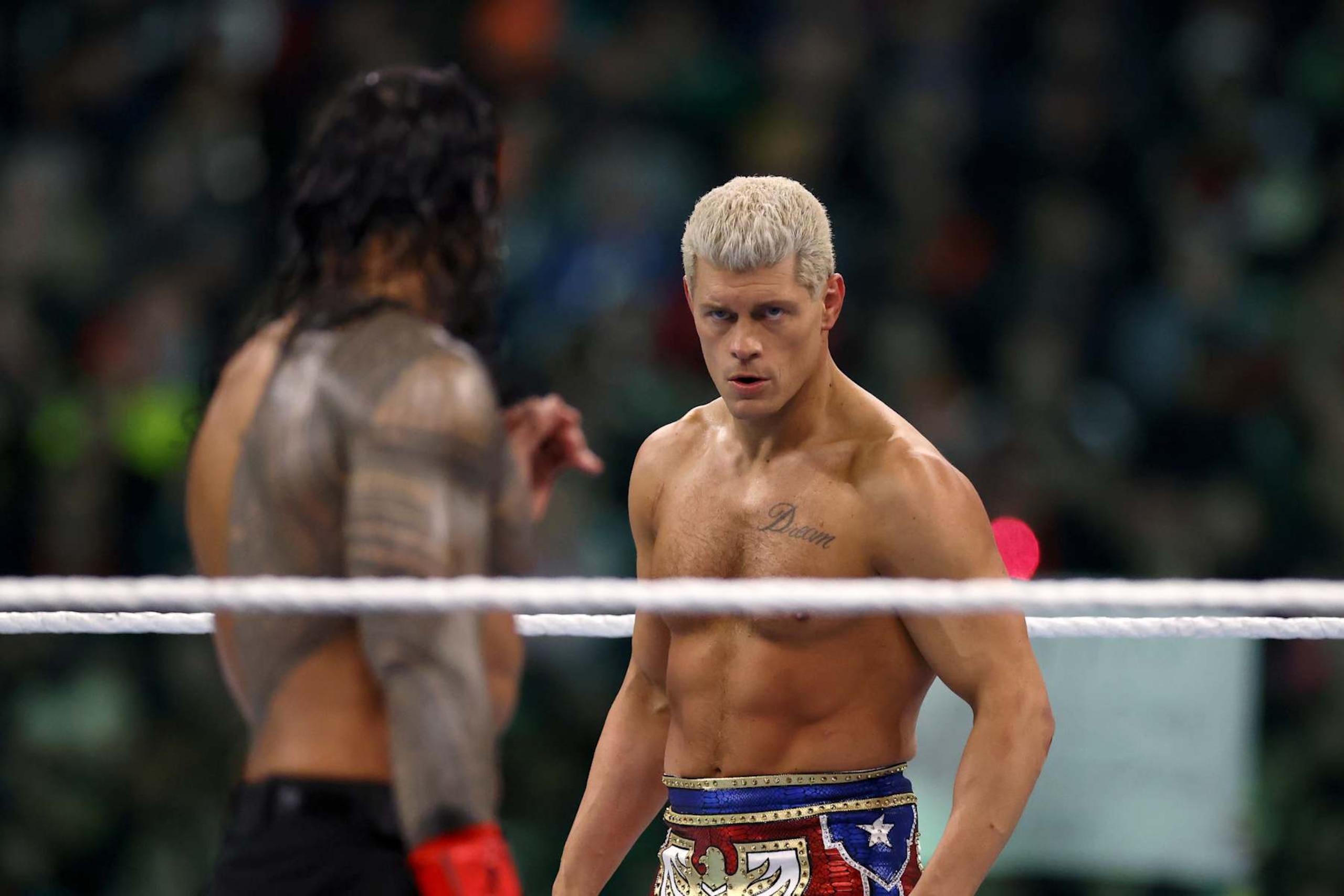 PHILADELPHIA, PENNSYLVANIA - APRIL 07: Roman Reigns and Cody Rhodes look on during Night Two at Lincoln Financial Field on April 07, 2024 in Philadelphia, Pennsylvania.  (Photo by Tim Nwachukwu/Getty Images)