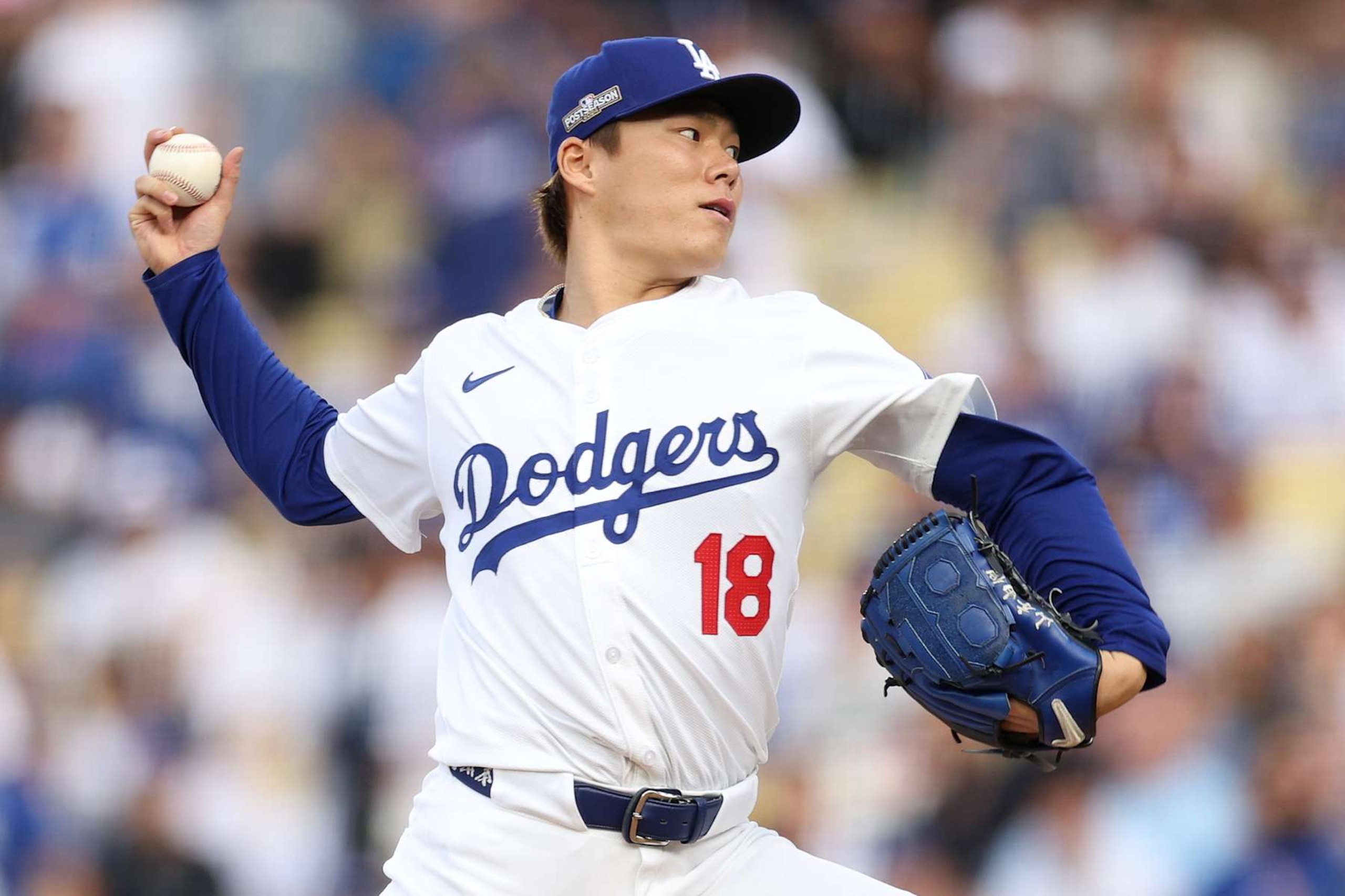 LOS ANGELES, CALIFORNIA - OCTOBER 11: Yoshinobu Yamamoto #18 of the Los Angeles Dodgers pitches the ball against the San Diego Padres during the first inning of Game Five of the Division Series at Dodger Stadium on October 11, 2024 in Los Angeles, California.  (Photo by Harry How/Getty Images)