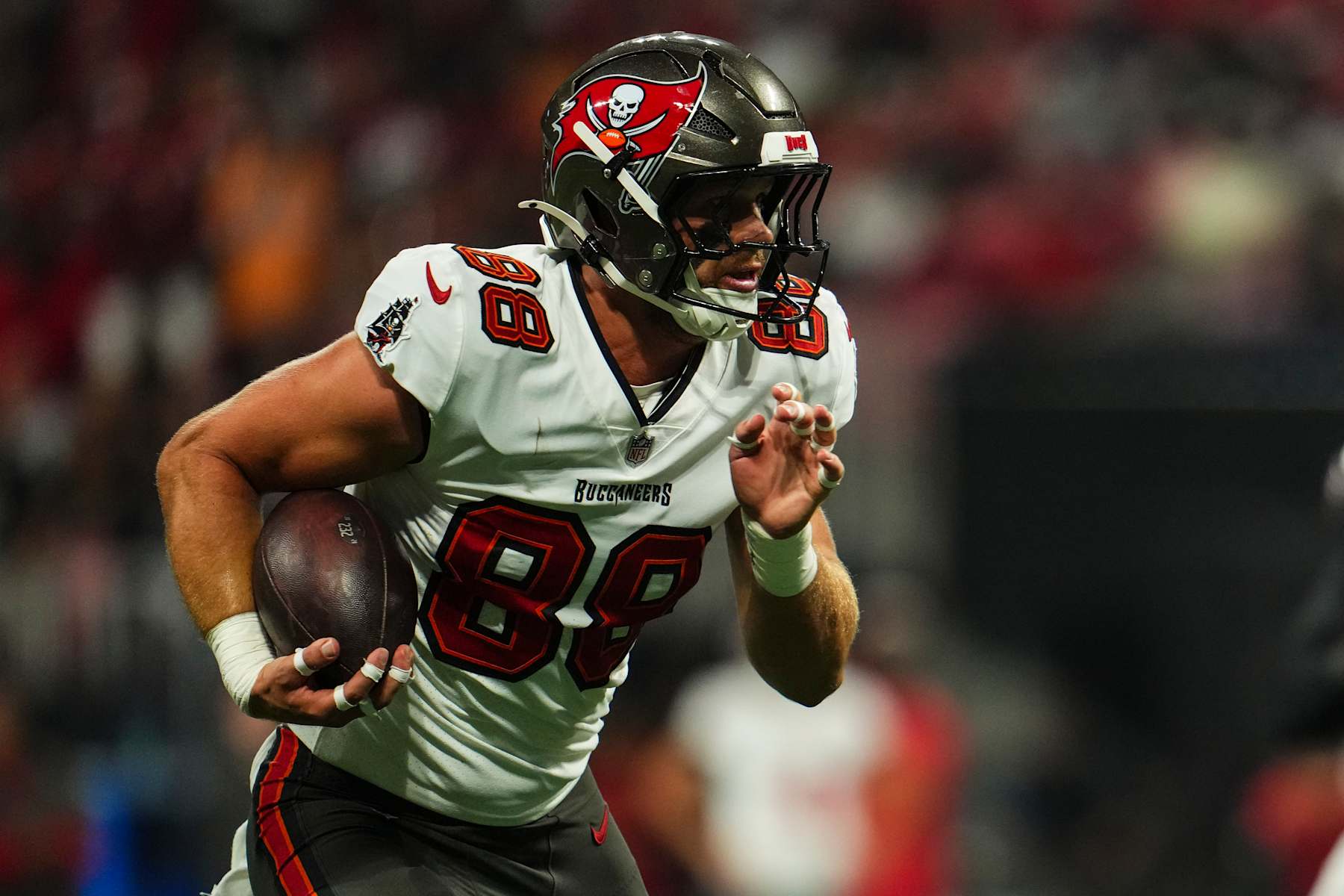 ATLANTA, GA - OCTOBER 03: Cade Otton #88 of the Tampa Bay Buccaneers runs the ball during an NFL football game against the Atlanta Falcons at Mercedes-Benz Stadium on October 3, 2024 in Atlanta, Georgia. (Photo by Cooper Neill/Getty Images)